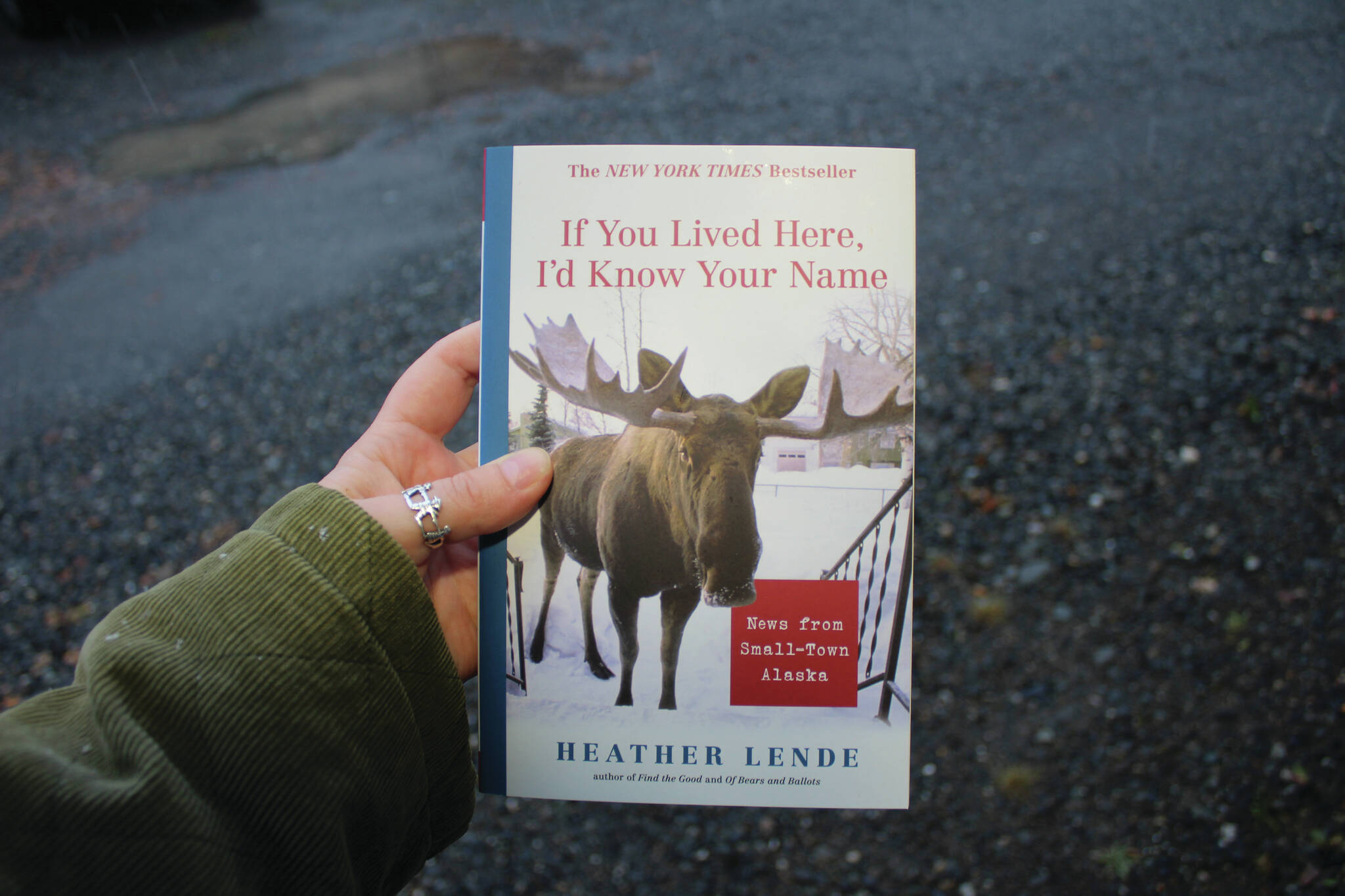 Ashlyn O’Hara/Peninsula Clarion
A copy of “If You Lived Here, I’d Know Your Name” is held on Thursday near Soldotna.