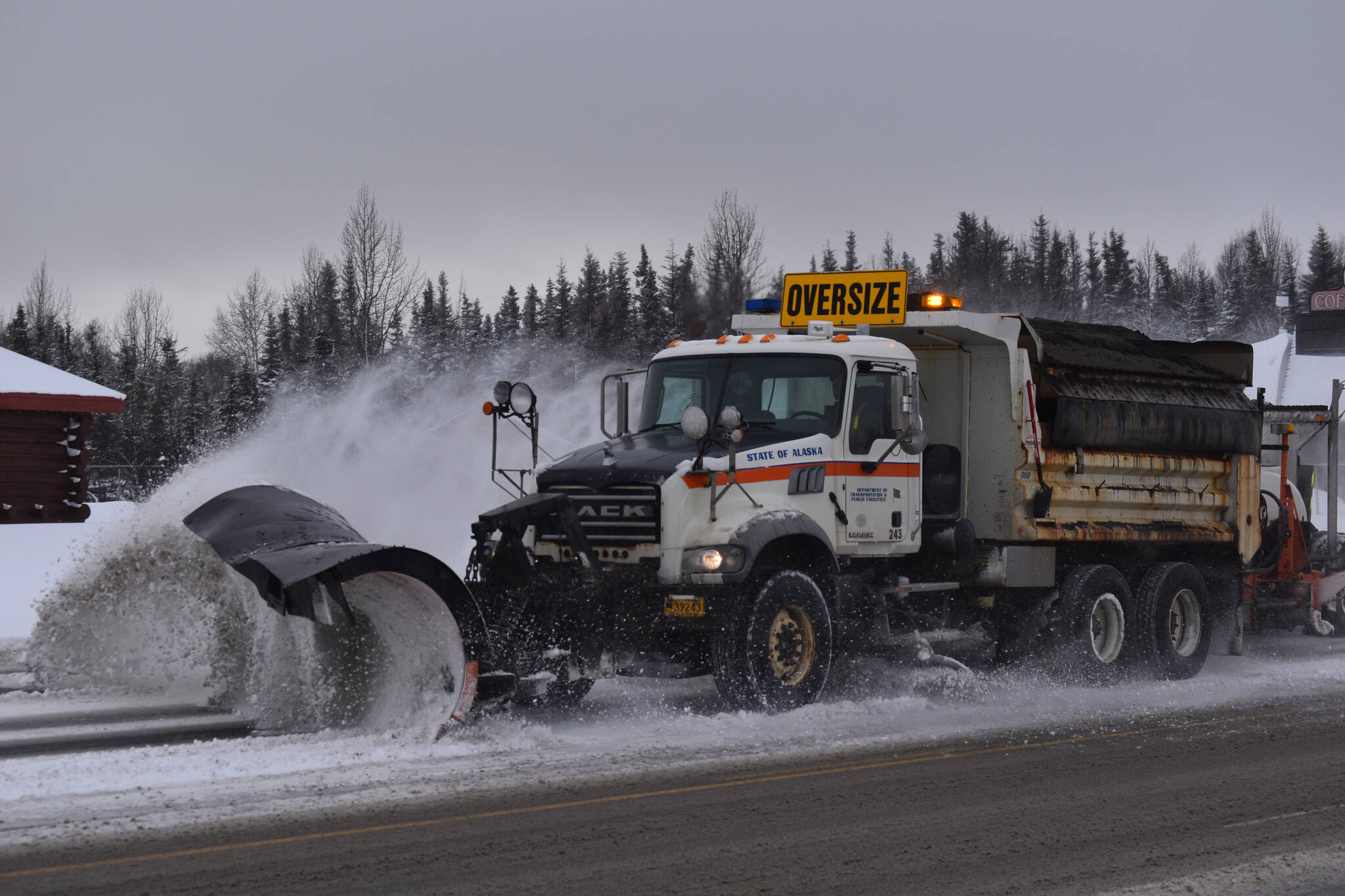 A plow truck clears snow from the Kenai Spur Highway on Wednesday, Nov. 2, 2022 in Kenai, Alaska. (Jake Dye/Peninsula Clarion)