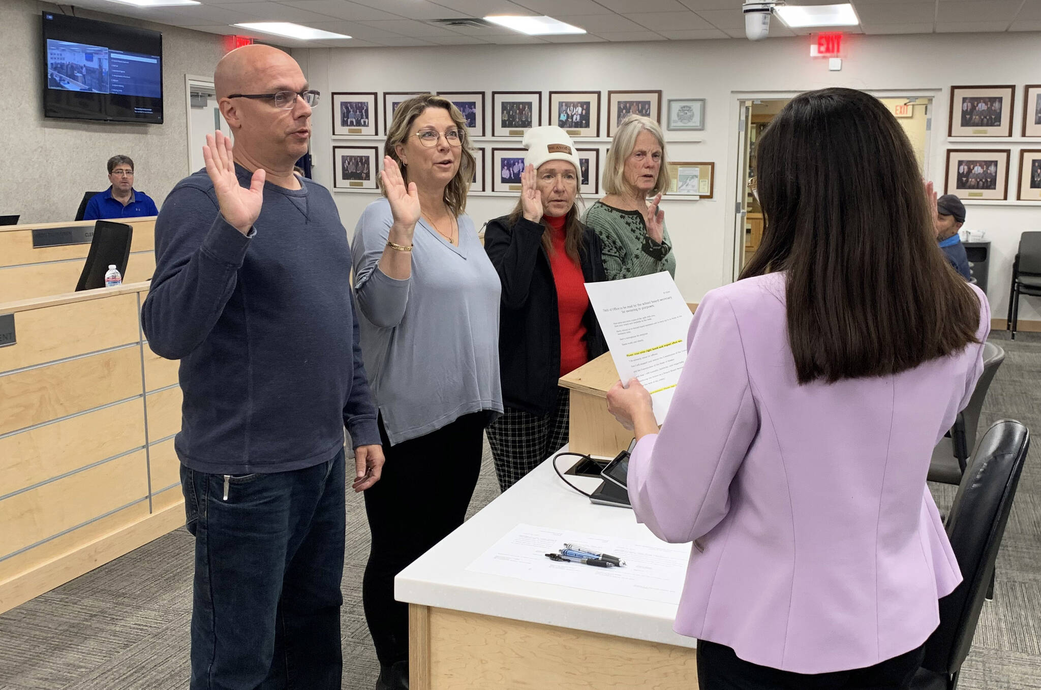 From left, Kenai Peninsula Borough School District Board of Education members Jason Tauriainen, Kelley Cizek, Dianne MacRae and Penny Vadla are sworn in by District Secretary Nikkol Sipes during a special school board meeting on Monday, Oct. 16, 2023 in Soldotna, Alaska. (Ashlyn O’Hara/Peninsula Clarion)