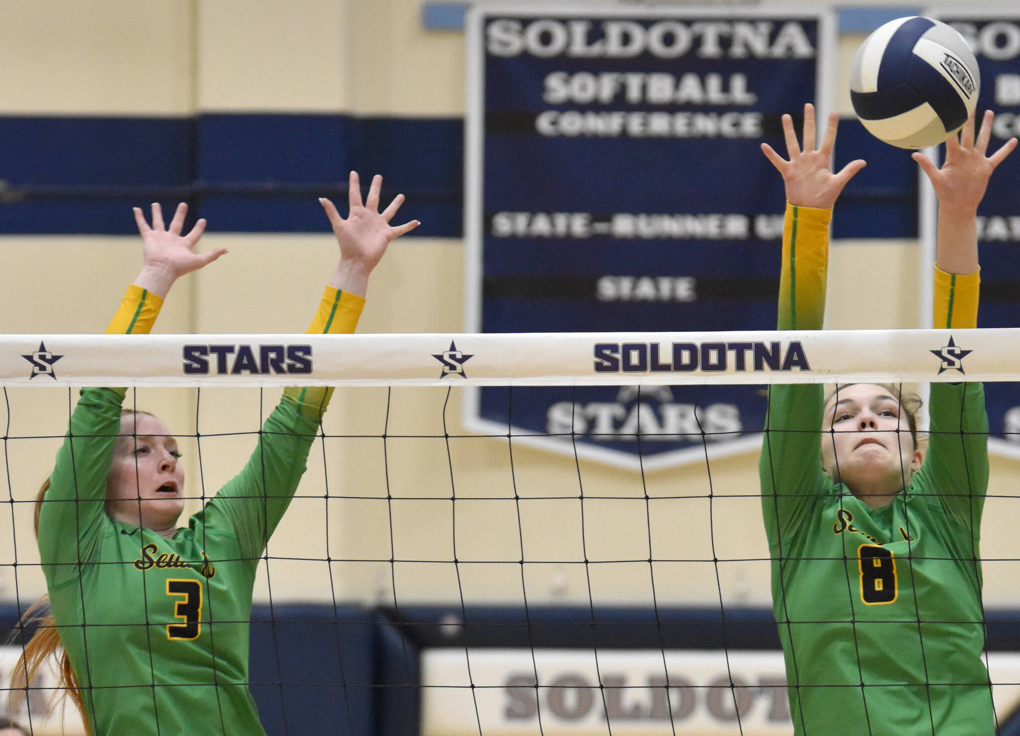 Seward’s Robin Cronin and McKinley Williams put up a block against Soldotna on Tuesday, Oct. 17, 2023, at Soldotna High School in Soldotna, Alaska. (Photo by Jeff Helminiak/Peninsula Clarion)