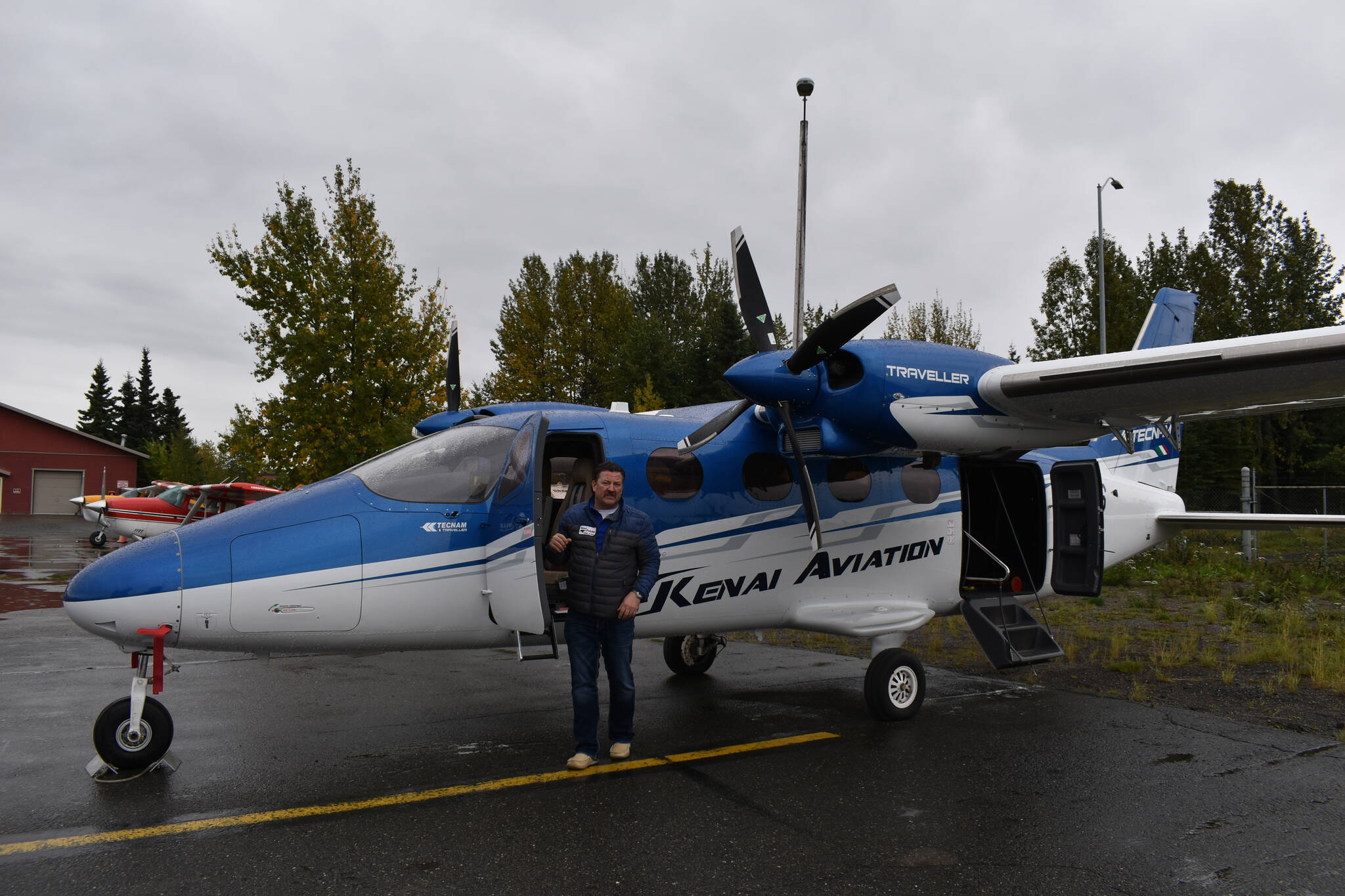 Joel Caldwell shows off the new Tecnam Traveller on Thursday, Sept. 15, 2022, in Kenai, Alaska. (Jake Dye/Peninsula Clarion)