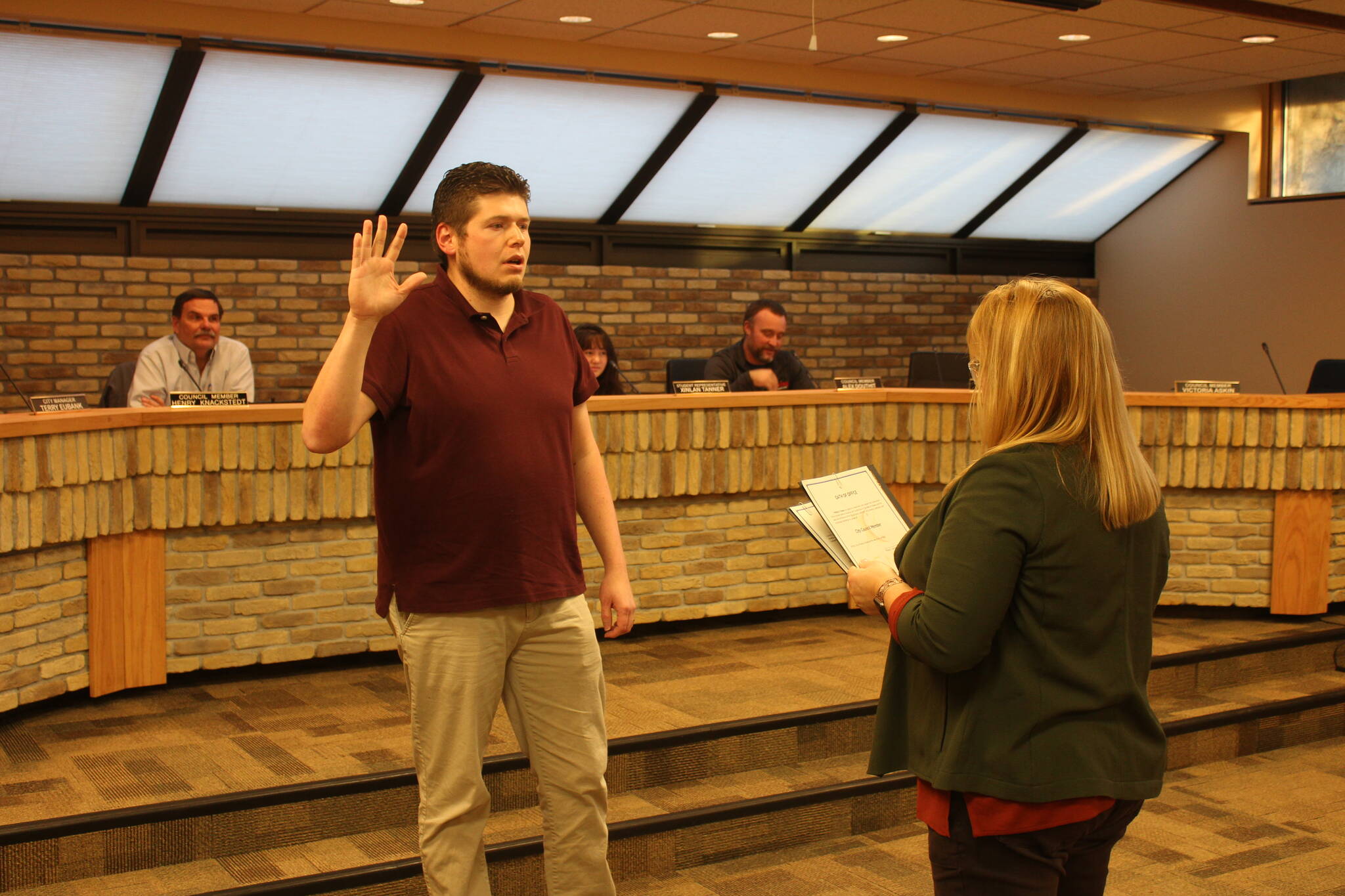 Kenai City Clerk Shellie Saner (right) administers an oath of office to Phillip Daniel during a Kenai City Council meeting on Thursday, Oct. 19, 2023 in Kenai, Alaska. Daniel was elected to the council during the Oct. 3 election. (Ashlyn O’Hara/Peninsula Clarion)