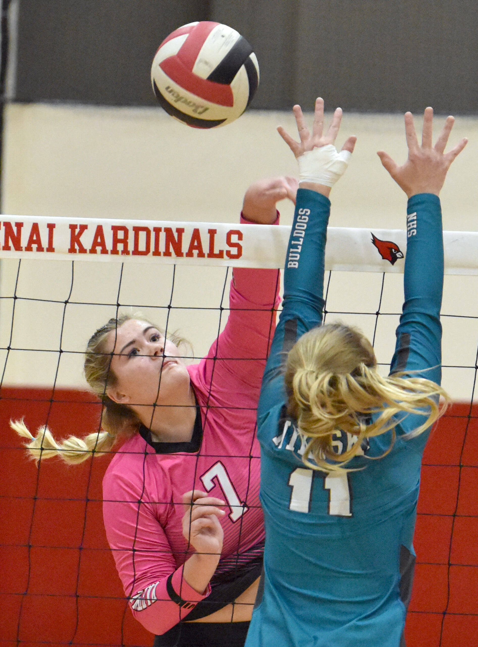 Kenai Centrals Emma Beck attacks Nikiskis Evelyn Reichert on Tuesday, Oct. 24, 2023, at Kenai Central High School in Kenai, Alaska. (Photo by Jeff Helminiak/Peninsula Clarion)