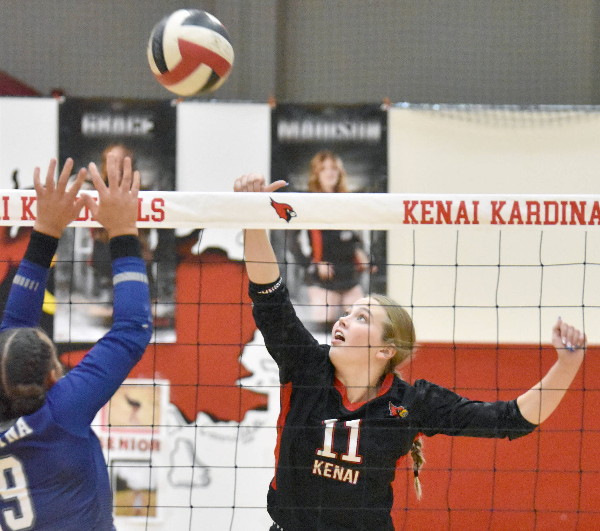 Kenai Central’s Grace Beiser attacks against Soldotna’s Athena Rossiter on Thursday, Oct. 26, 2023, at Kenai Central High School in Kenai, Alaska. (Photo by Jeff Helminiak/Peninsula Clarion)