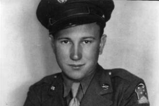 This is an early photo of U.S. Army soldier Arlon Elwood “Jackson” Ball in uniform. The patches, ribbons and medals on this uniform demonstrate that he had not yet served overseas or been involved in any combat. (Photo from Ball Family memorial slideshow, 2022)