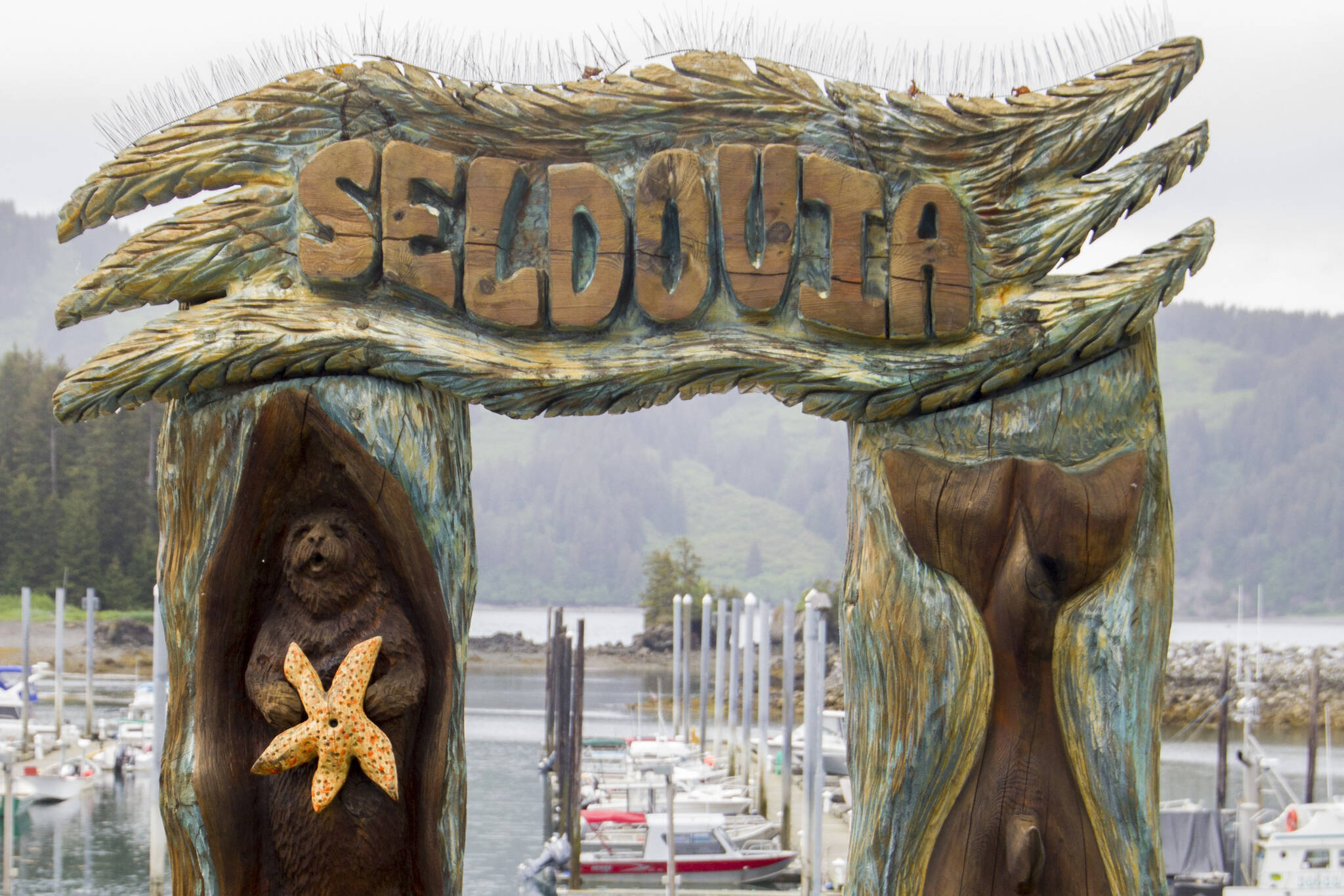 The Seldovia archway is one of the first landmarks visitors see when stepping off the boat. (Photo by Sarah Knapp/Homer News)