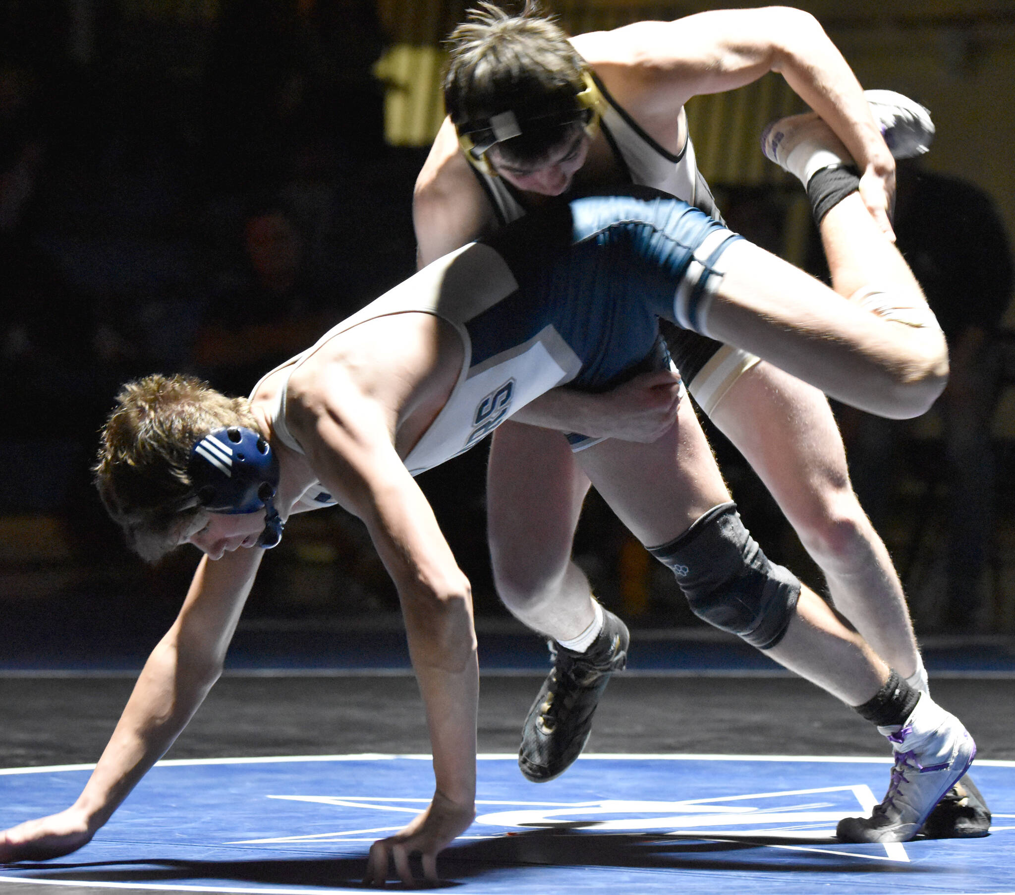 South's Zane Gerlach wrestles to victory against Soldotna's Trevor Michael on Friday, Nov. 3, 2023, at Soldotna High School in Soldotna, Alaska. (Photo by Jeff Helminiak/Peninsula Clarion)