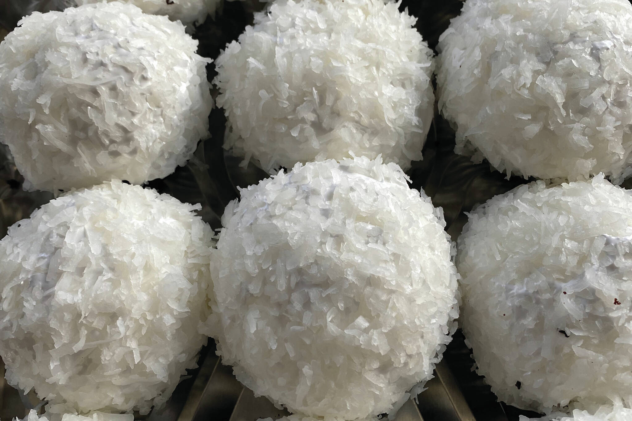 These snowballs are made of chocolate cupcakes are surrounded with sugary meringue and coconut flakes. (Photo by Tressa Dale/Peninsula Clarion)