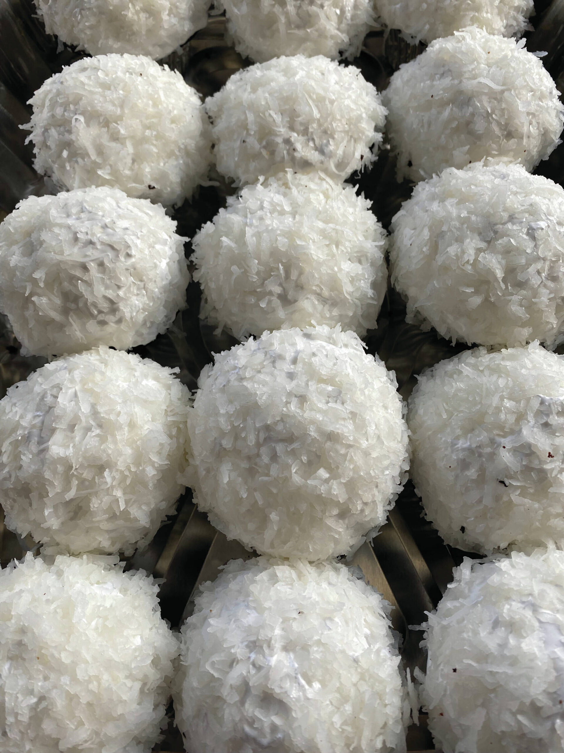 These snowballs are made of chocolate cupcakes are surrounded with sugary meringue and coconut flakes. (Photo by Tressa Dale/Peninsula Clarion)