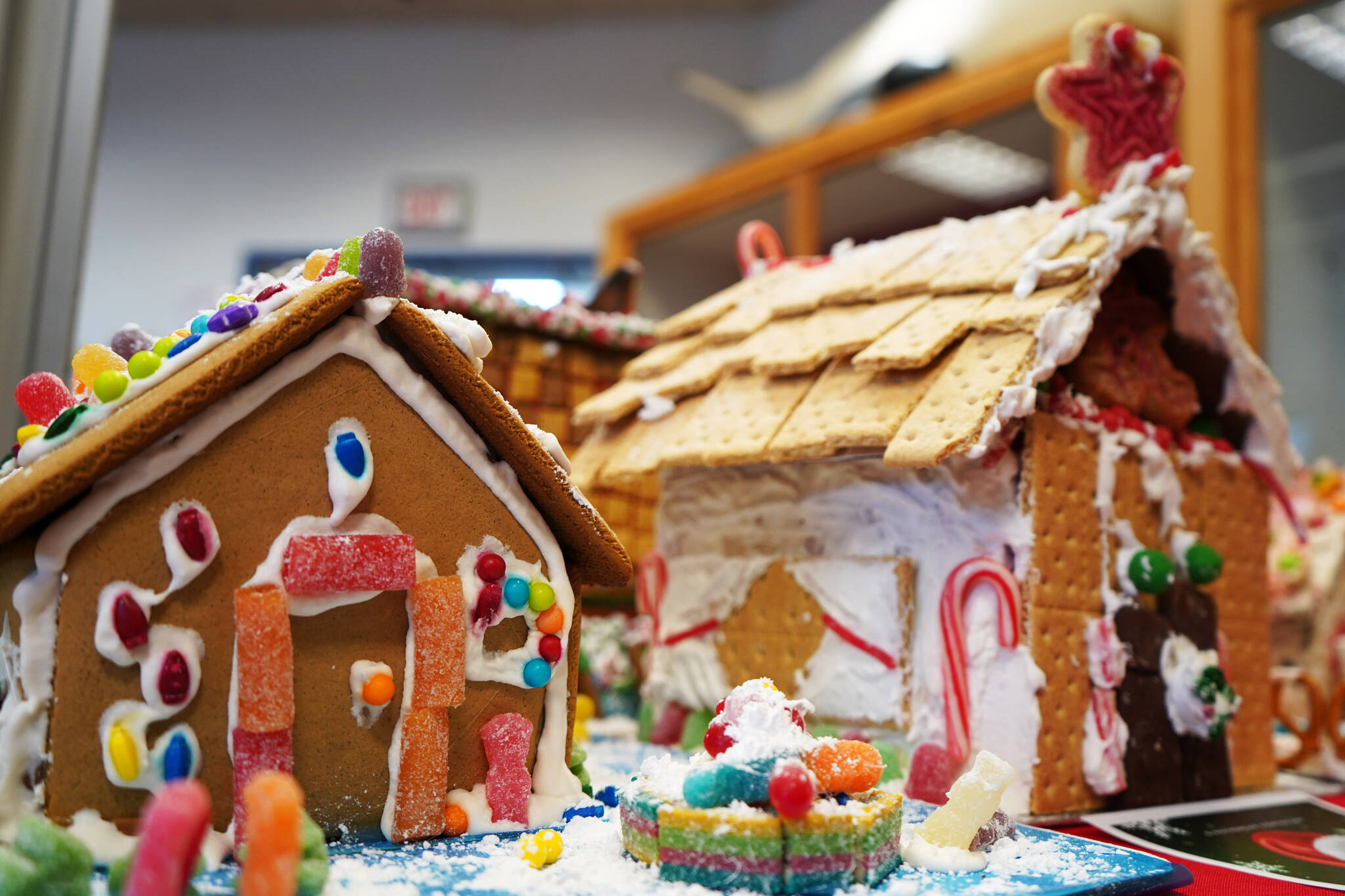 Gingerbread houses constructed by 4-year-old Izzy and 5-year-old Judah are displayed as part of the 11th Annual Gingerbread House Contest at the Kenai Chamber of Commerce and Visitor Center in Kenai, Alaska, on Thursday, Nov. 16, 2023. (Jake Dye/Peninsula Clarion)