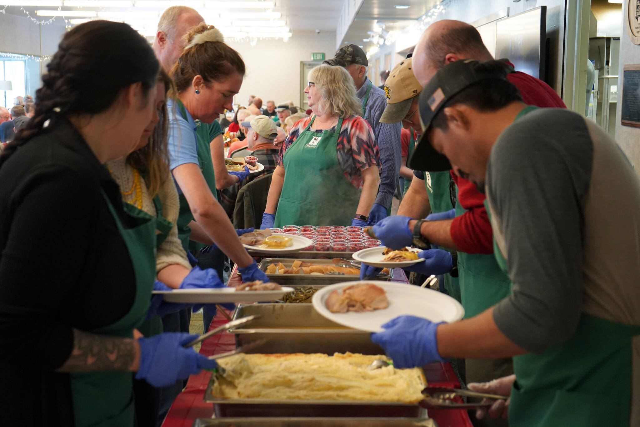 Thanksgiving dinners are assembled at the Kenai Senior Center in Kenai, Alaska, on Friday, Nov. 17, 2023. (Jake Dye/Peninsula Clarion)