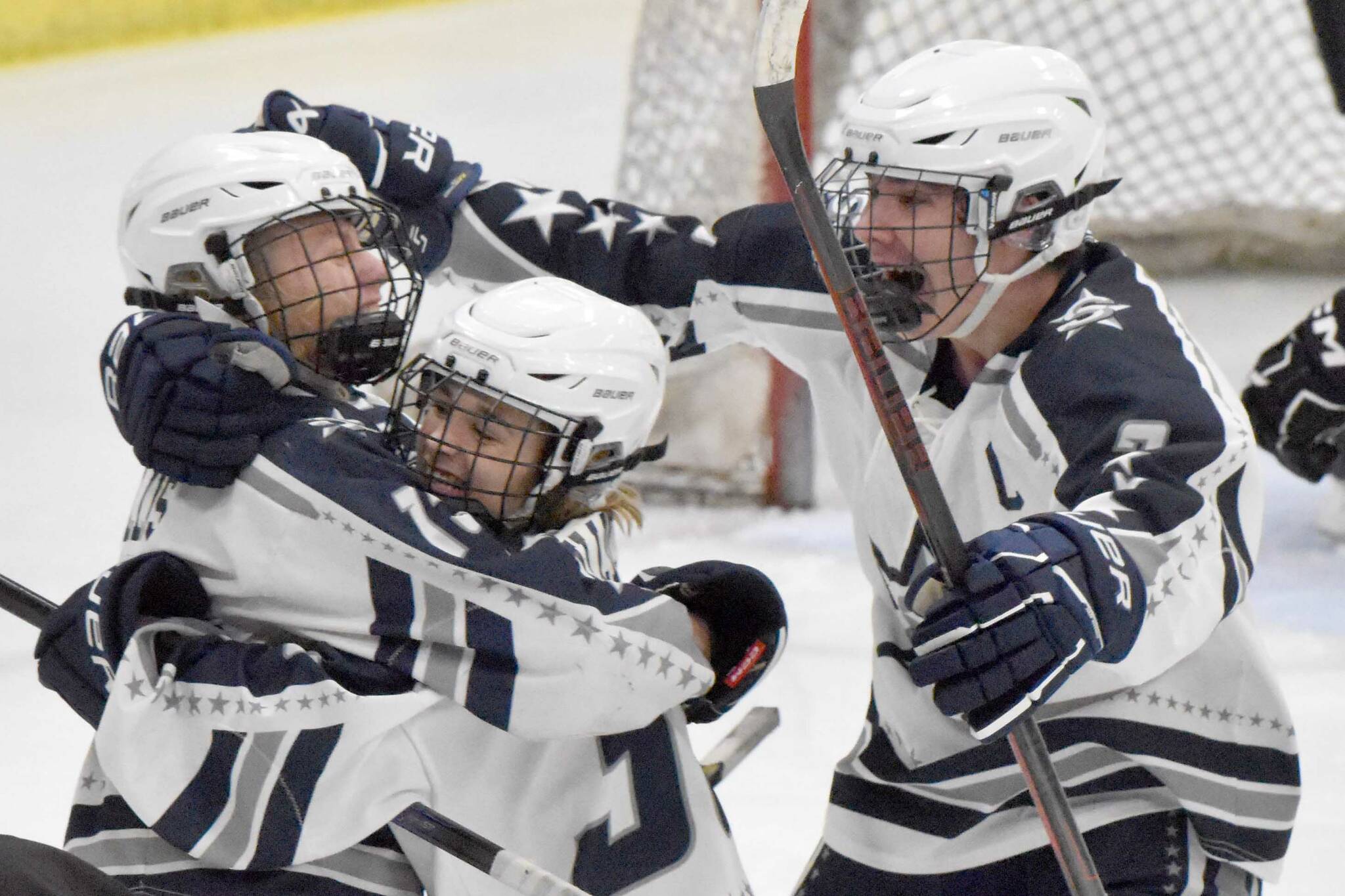 Soldotna's Chase Willis (left) celebrates his goal against Juneau-Douglas: Yadaa.at Kale with Draiden Mullican and Andrew Arthur on Friday, Nov. 17, 2023, at the Soldotna Regional Sports Complex in Soldotna, Alaska. (Photo by Jeff Helminiak/Peninsula Clarion)
