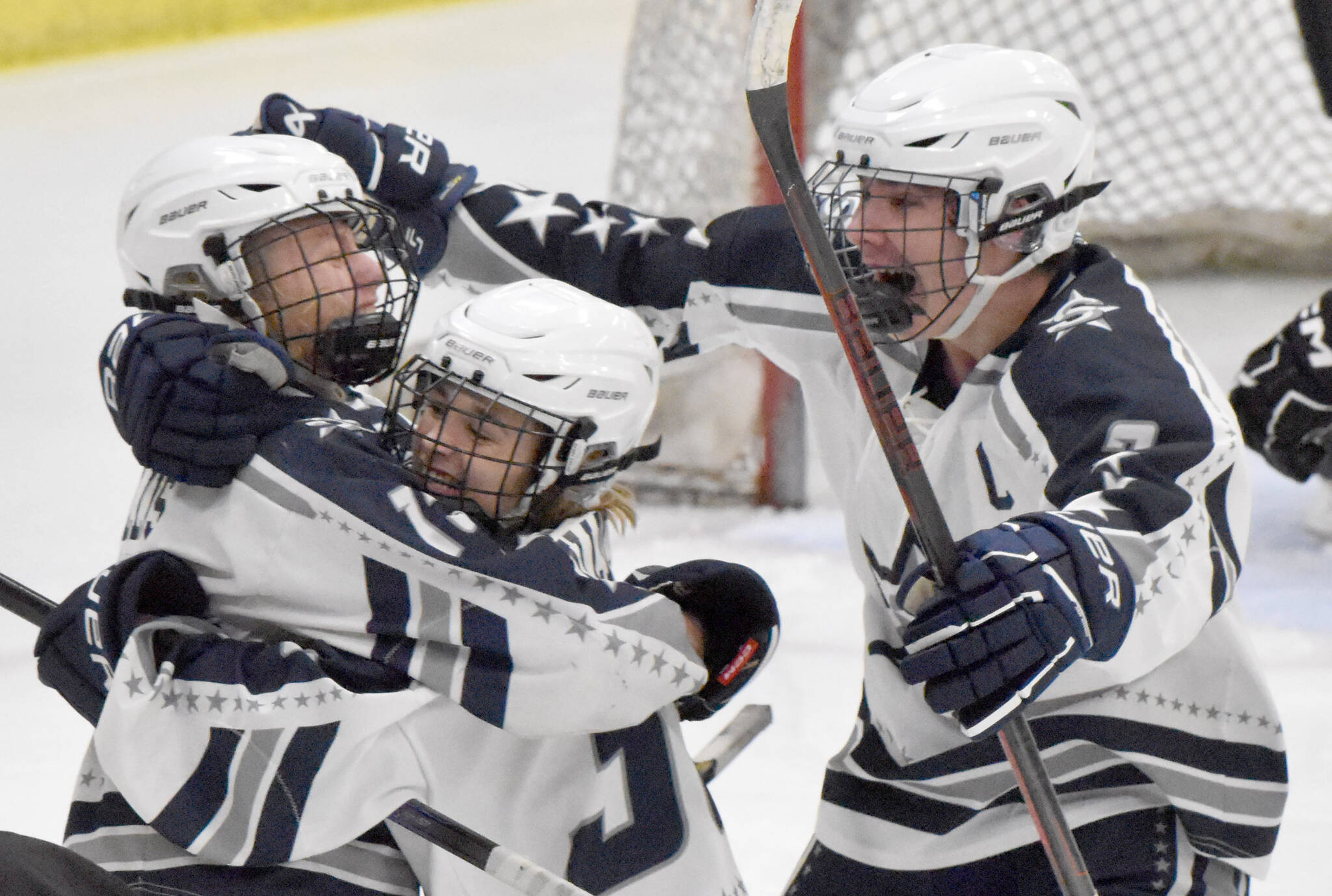 Soldotna’s Chase Willis (left) celebrates his goal against Juneau-Douglas: Yadaa.at Kale with Draiden Mullican and Andrew Arthur on Friday, Nov. 17, 2023, at the Soldotna Regional Sports Complex in Soldotna, Alaska. (Photo by Jeff Helminiak/Peninsula Clarion)