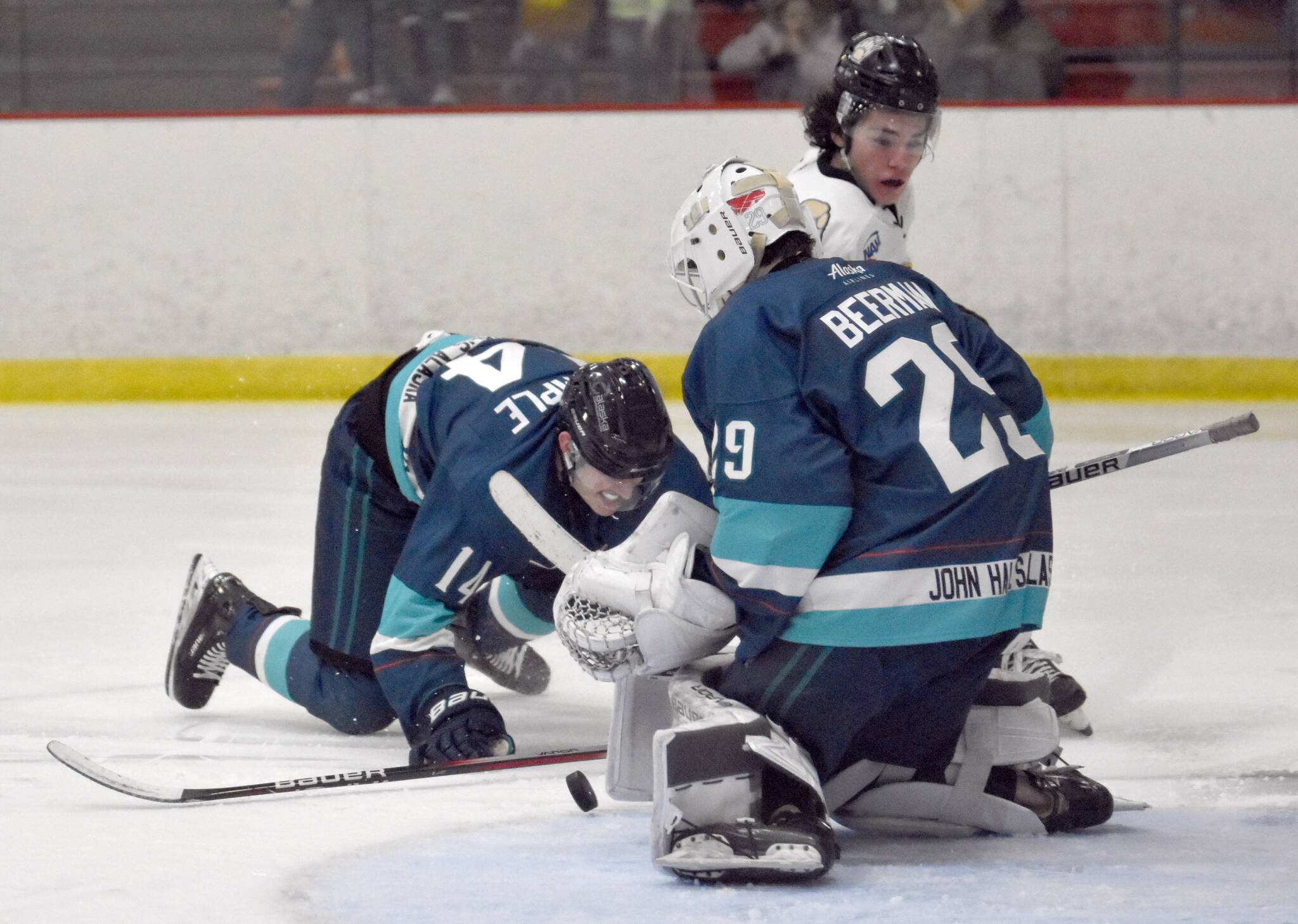 Kenai River’s Dylan Contreras drives the net against Anchorage Wolverines’ Jackson Stimple and Liam Beerman on Saturday, Nov. 18, 2023, at the Soldotna Regional Sports Complex in Soldotna, Alaska. (Photo by Jeff Helminiak/Peninsula Clarion)