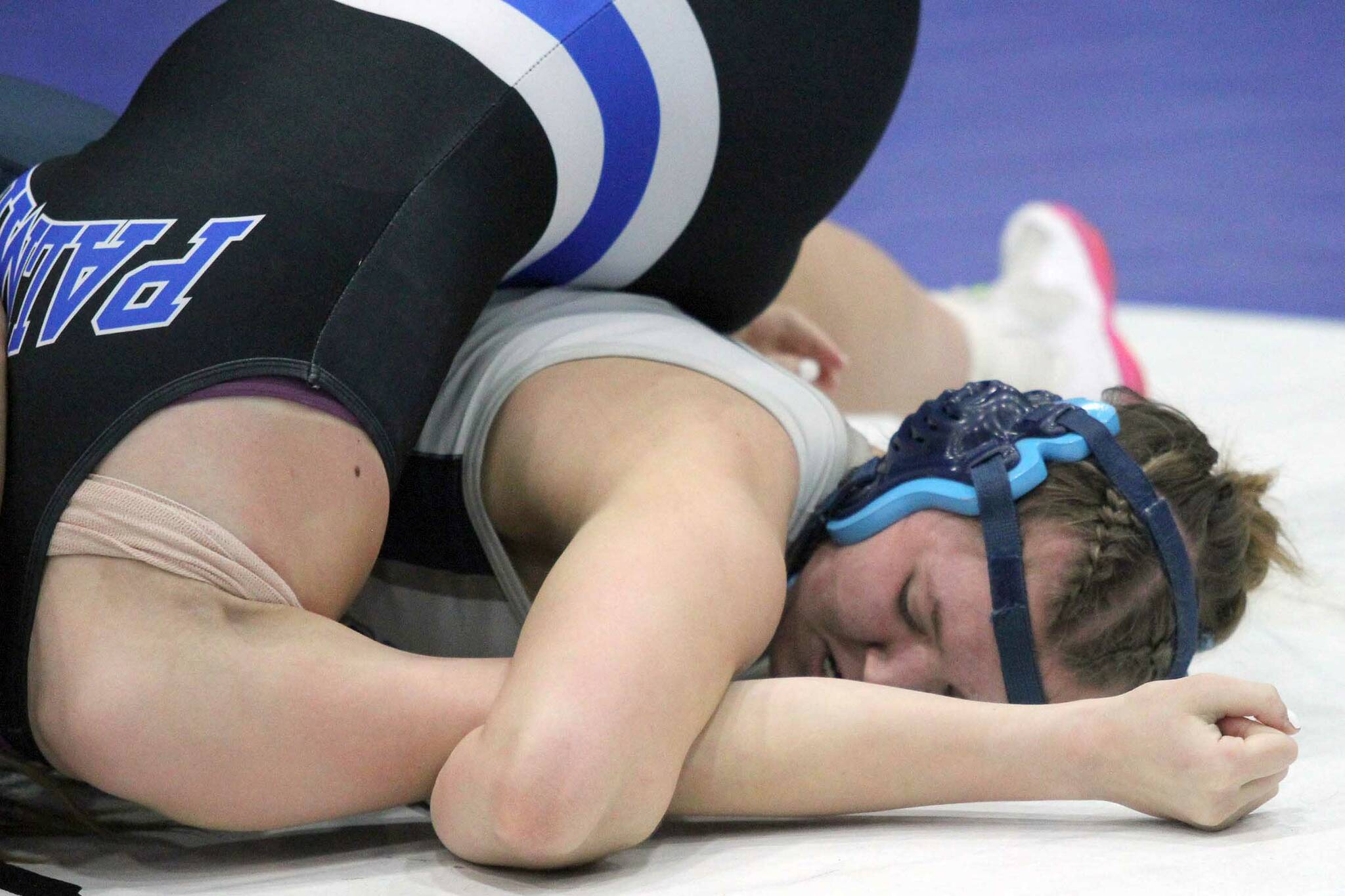 Soldotna junior Daisy Hannevold tries to turn Palmerճ Lillie Vansiegman during the girls 138-pound final of the Lancer Smith Memorial on Saturday, Nov. 18, 2023, at the Menard Arena in Wasilla. (Photo by Jeremiah Bartz/Frontiersman)