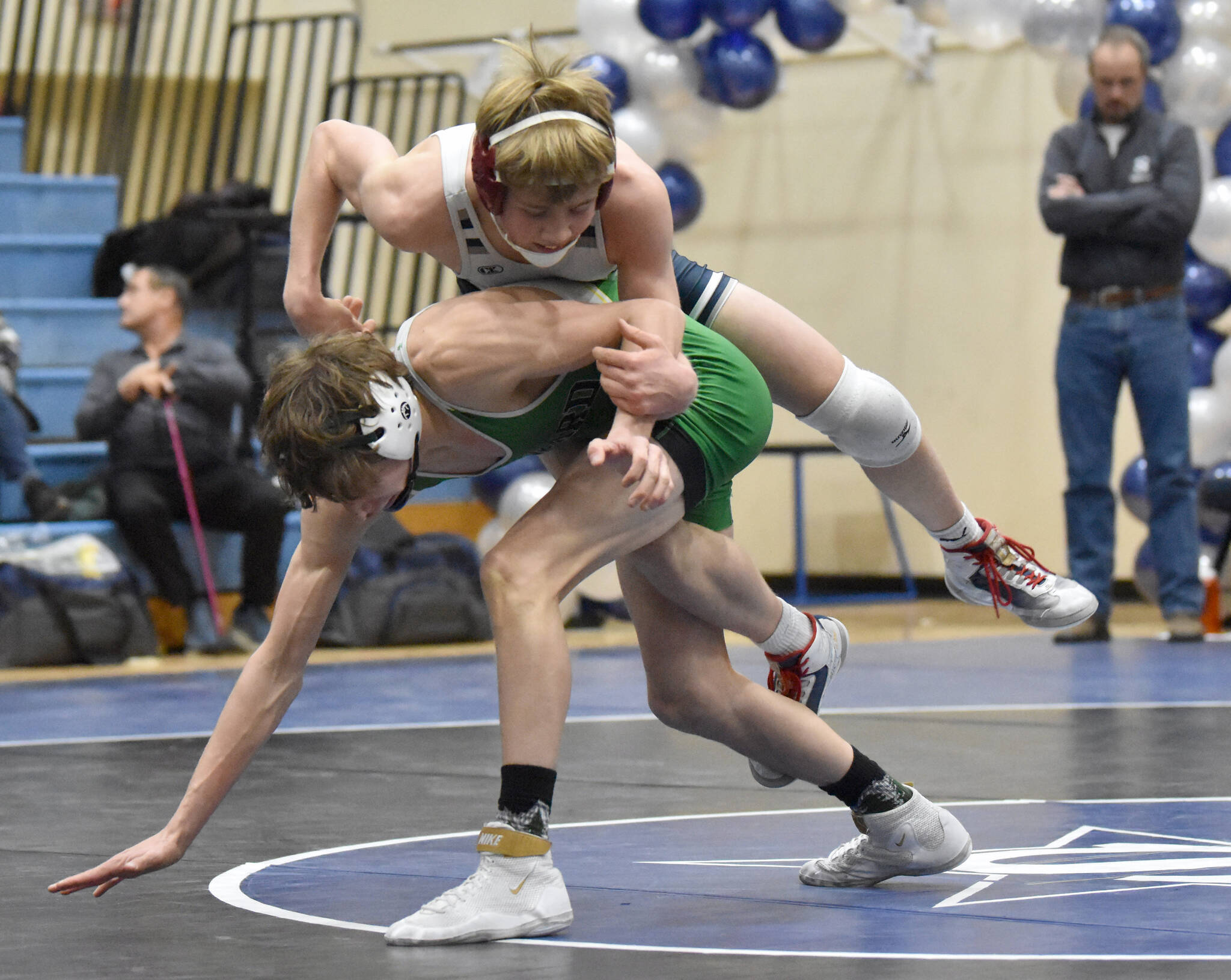 Soldotna’s Jacob Strausbaugh and Seward’s Hunter Forshee-Kurtz battle at 130 pounds Tuesday, Nov. 21, 2023, at Soldotna High School in Soldotna, Alaska. Strausbaugh won 7-6. (Photo by Jeff Helminiak/Peninsula Clarion)