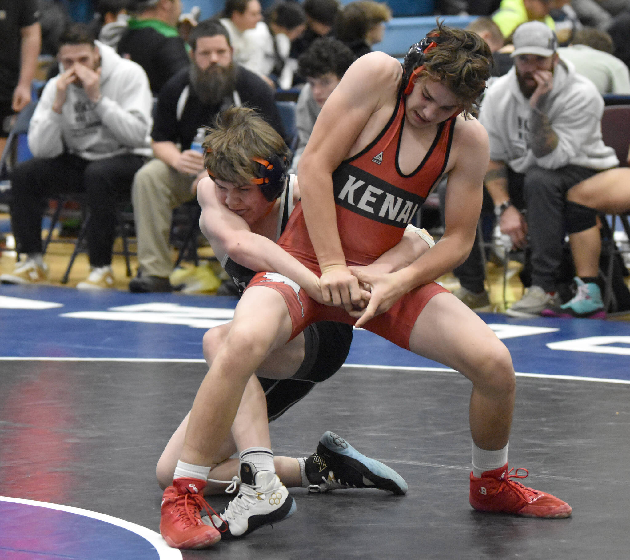 Nikiski’s Brody Nelson and Kenai’s Macalen Marion battle in an exhibition at 152 pounds Tuesday, Nov. 21, 2023, at Soldotna High School in Soldotna, Alaska. Marion won by pin. (Photo by Jeff Helminiak/Peninsula Clarion)
