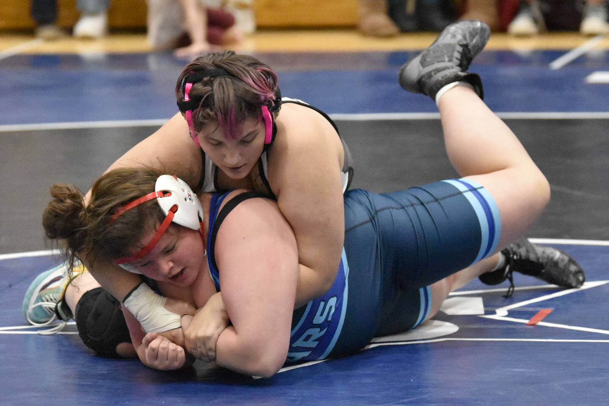 Nikiski's Destiny Langston and Soldotna' Meg Roberts battle at 235 pounds Tuesday, Nov. 21, 2023, at Soldotna High School in Soldotna, Alaska. Roberts won 7-4. (Photo by Jeff Helminiak/Peninsula Clarion)