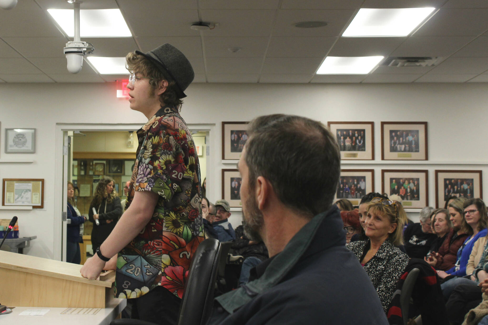 Soldotna High School senior Josiah Burton testifies in opposition to the proposed cut of Kenai Peninsula Borough School District theater technicians while audience members look on during a board of education meeting on Monday, March 6, 2023 in Soldotna, Alaska. (Ashlyn O’Hara/Peninsula Clarion)