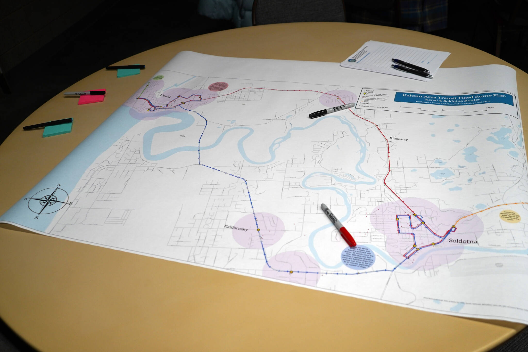 A preliminary Kenai and Soldotna route for the Kahtnu Area Transit sits ready for comment alongside markers and sticky notes at the Challenger Learning Center of Alaska in Kenai, Alaska, on Wednesday, Nov. 29, 2023. (Jake Dye/Peninsula Clarion)