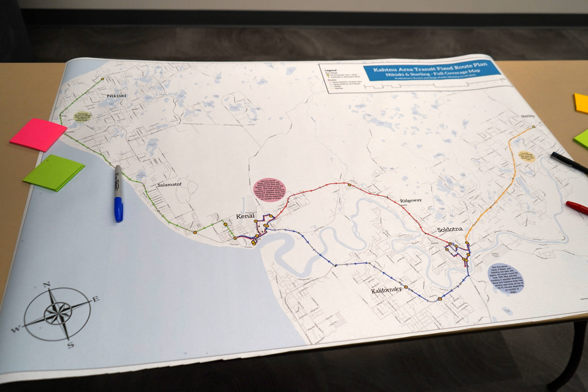 A preliminary full coverage map for the Kahtnu Area Transit sits ready for comment alongside markers and sticky notes at the Challenger Learning Center of Alaska in Kenai, Alaska, on Wednesday, Nov. 29, 2023. (Jake Dye/Peninsula Clarion)