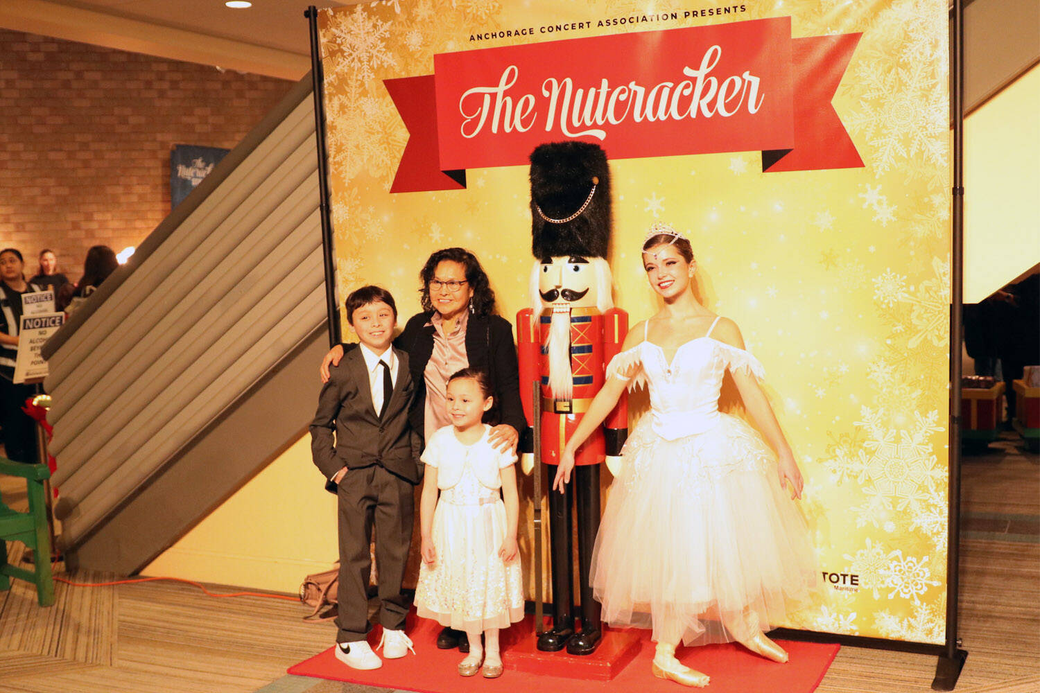Sara DeVolld, right, stands for photos with attendees of “The Nutcracker” with Eugene Ballet at the Alaska Center for the Performing Arts in Anchorage, Alaska. (Photo courtesy Shona DeVolld)