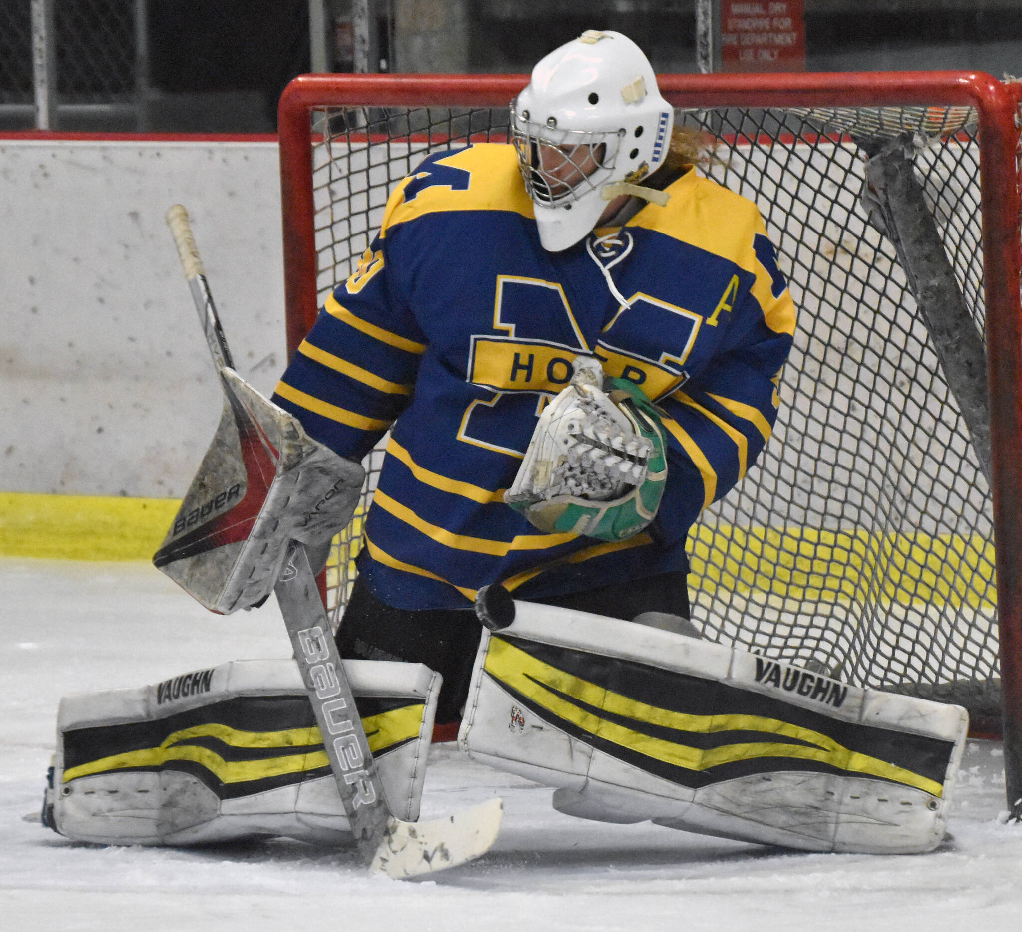 Homer’s Blaise Banks makes a save against Kenai Central on Thursday, Nov. 30, 2023, at the Kenai Multi-Purpose Facility in Kenai, Alaska. (Photo by Jeff Helminiak/Peninsula Clarion)