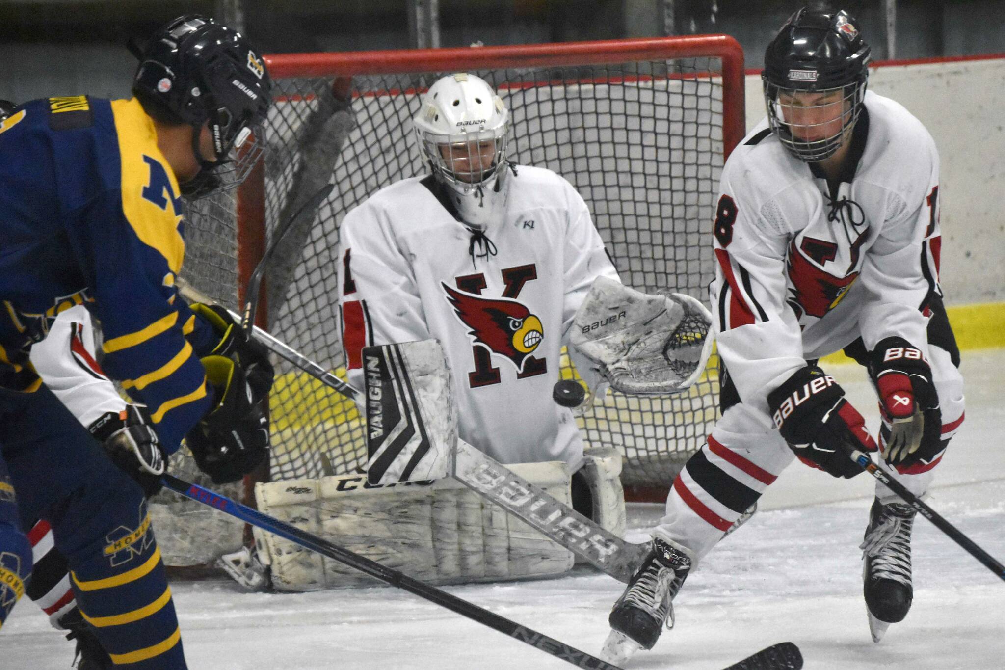 Kenai Central's Seanna Swanson and Sawyer Vann look to block a shot Thursday, Nov. 30, 2023, at the Kenai Multi-Purpose Facility in Kenai, Alaska. (Photo by Jeff Helminiak/Peninsula Clarion)