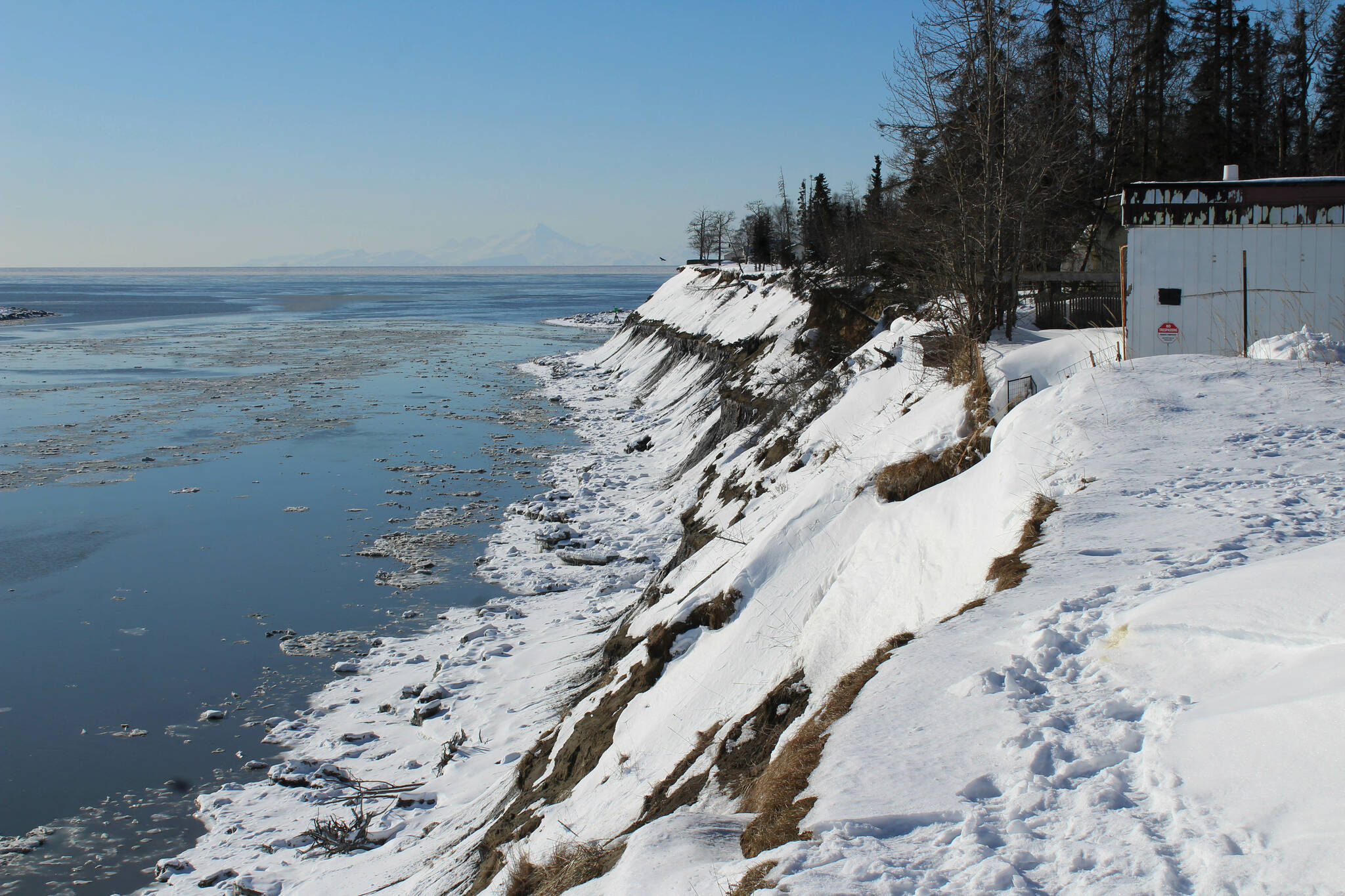 Snow coats an eroding bluff near the mouth of the Kenai River on Friday, March 3, 2023, in Kenai, Alaska. (Ashlyn O’Hara/Peninsula Clarion)