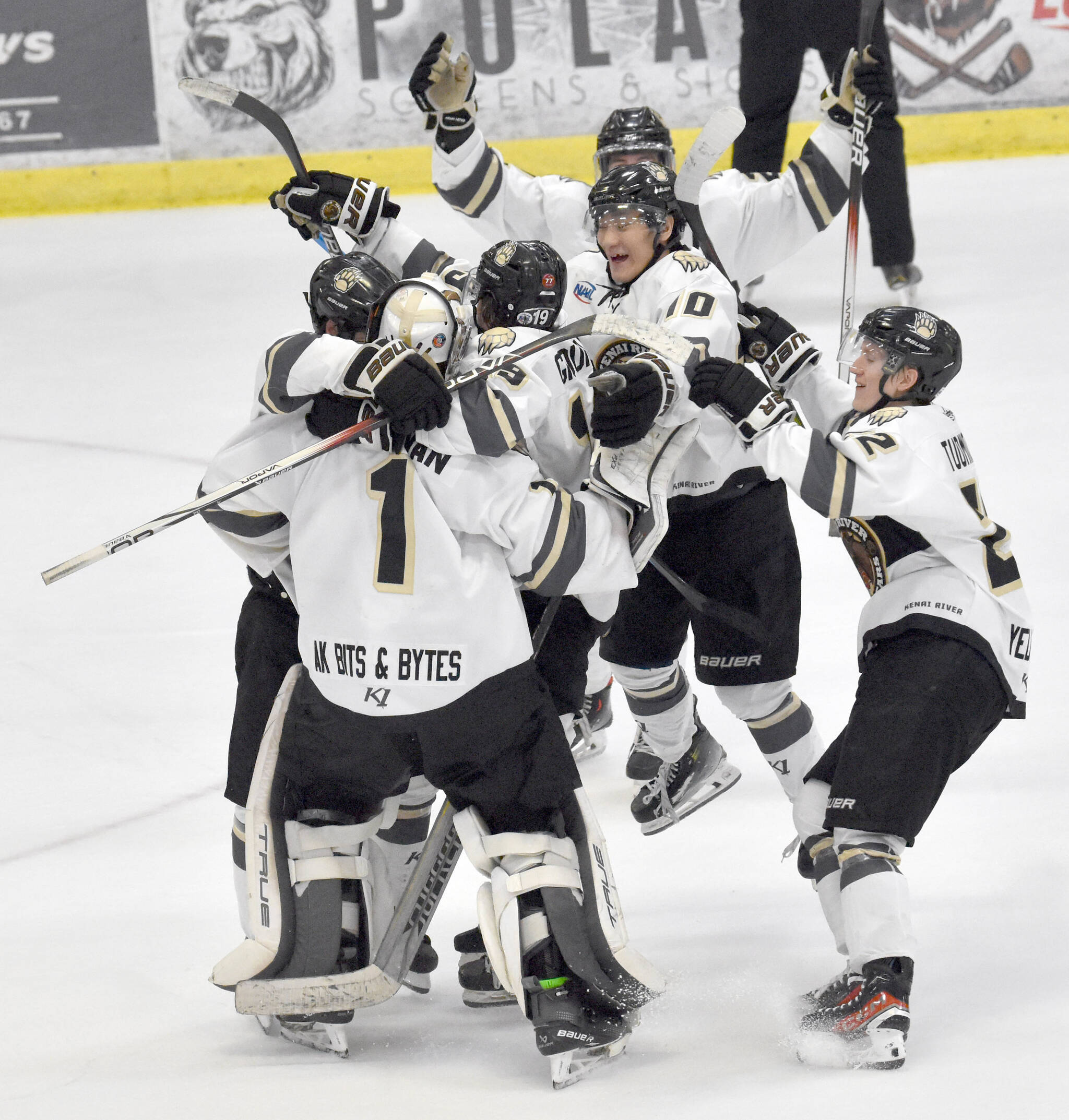The Kenai River Brown Bears celebrate a win over the Anchorage Wolverines on Friday, Dec. 1, 2023, at the Soldotna Regional Sports Complex in Soldotna, Alaska. (Photo by Jeff Helminiak/Peninsula Clarion)
