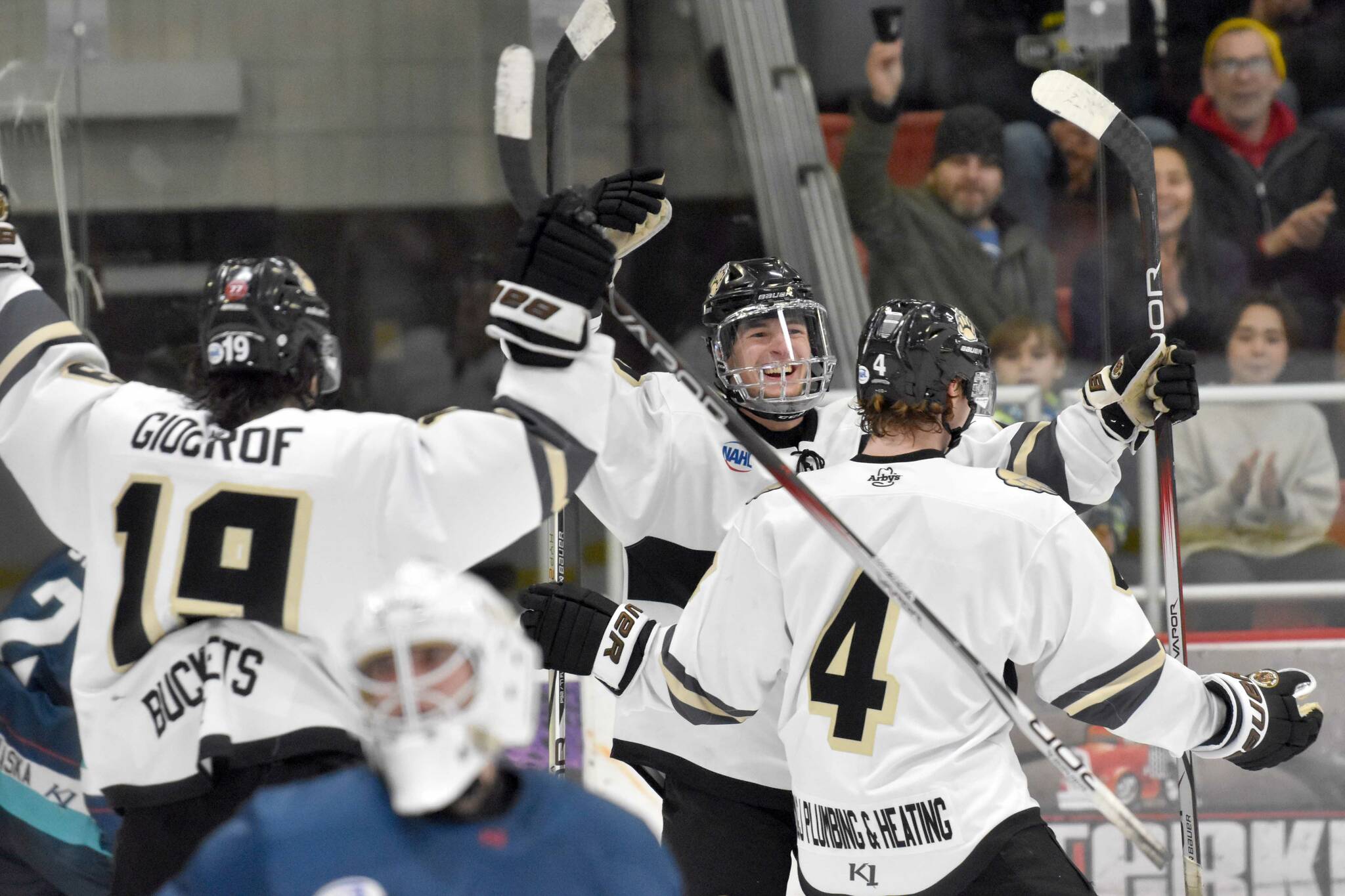 Kenai River Brown Bears defenseman Joe Manning celebrates his goal with Marko Giourof and Gavin Duckworth on Friday, Dec. 1, 2023, at the Soldotna Regional Sports Complex in Soldotna, Alaska. (Photo by Jeff Helminiak/Peninsula Clarion)