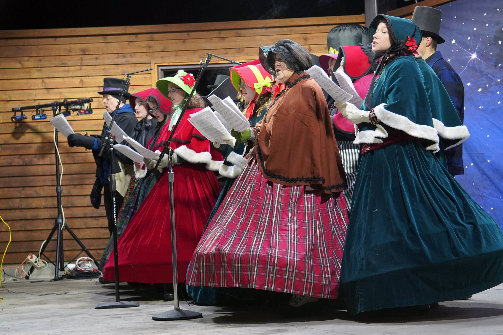 The Kenai Performers’ Victorian Carolers perform during Christmas in the Park at Soldotna Creek Park in Soldotna, Alaska, on Saturday, Dec. 2, 2023. (Jake Dye/Peninsula Clarion)