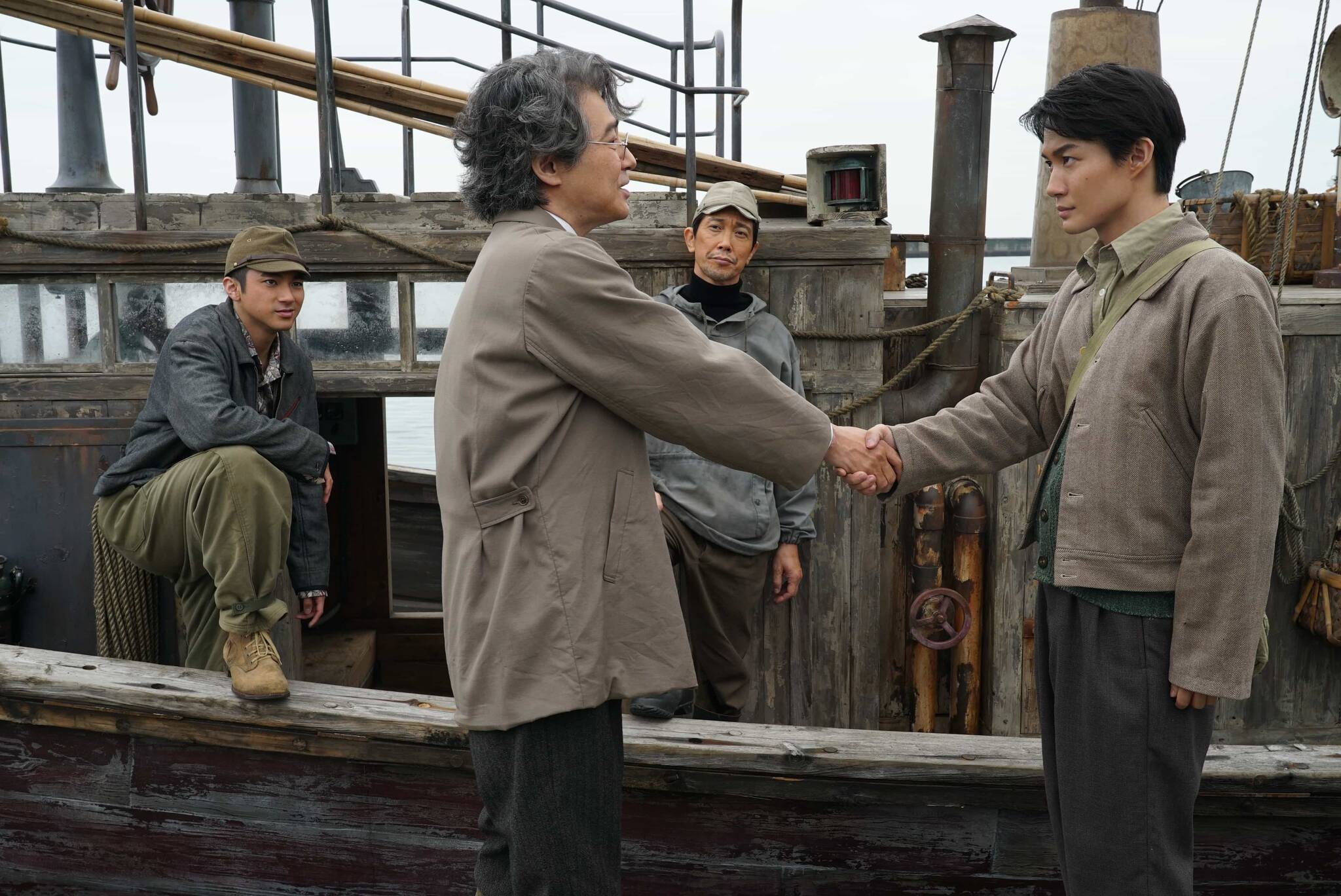 From left, Yuki Yamada portrays Shirō Mizushima, Hidetaka Yoshioka portrays Kenji Noda, Kuranosuke Sasaki portrays Yōji Akitsu and Ryunosuke Kamiki portrays Kōichi Shikishima in “Godzilla Minus One.” (Promotional photo courtesy Toho Studios)