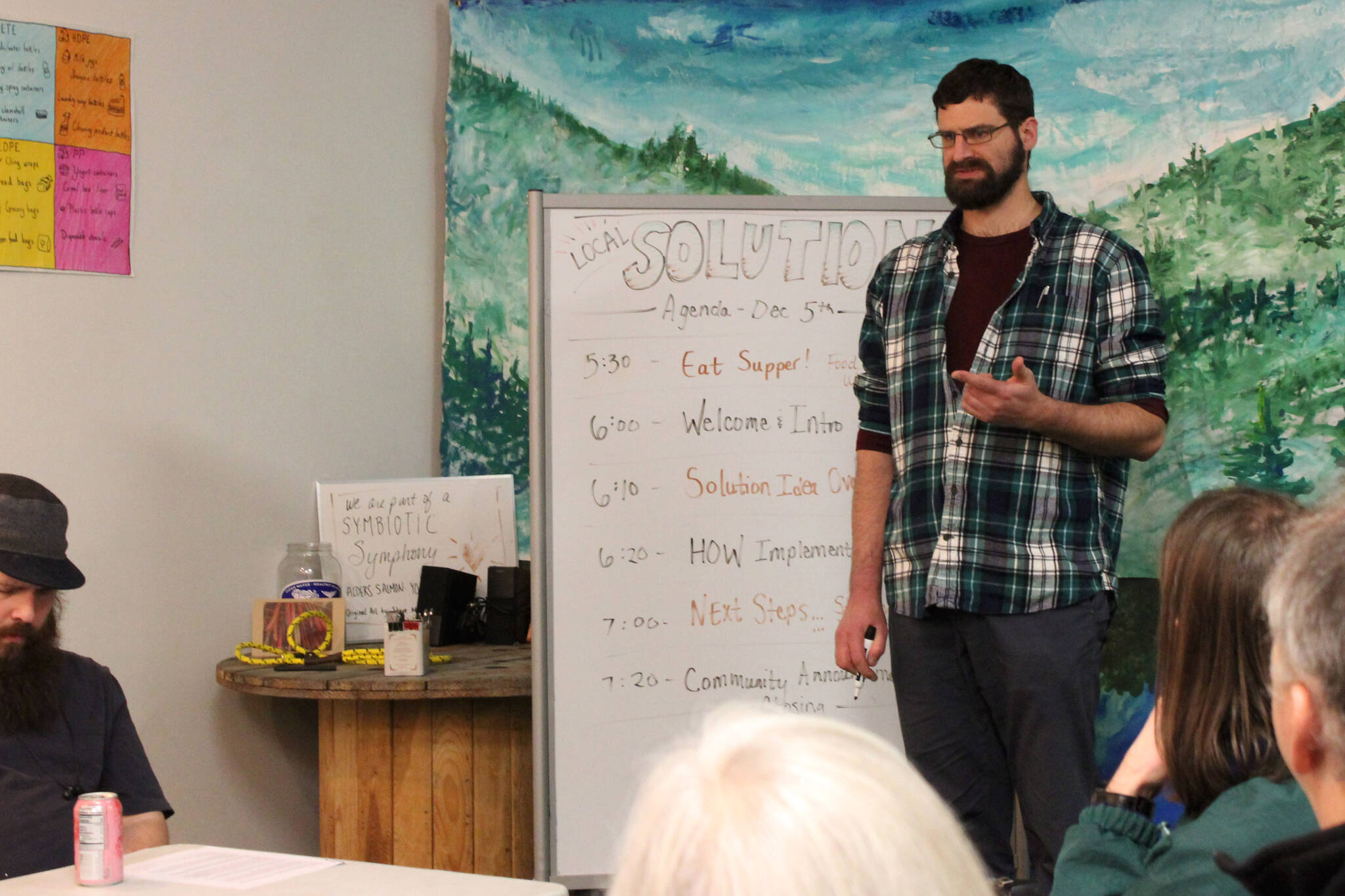 Cook Inletkeeper Energy Policy Analyst Ben Boettger presents information about retrofitting homes to be more energy efficient at the Cook Inletkeeper Community Action Studio on Tuesday, Dec. 5, 2023, in Soldotna, Alaska. (Ashlyn O’Hara/Peninsula Clarion)