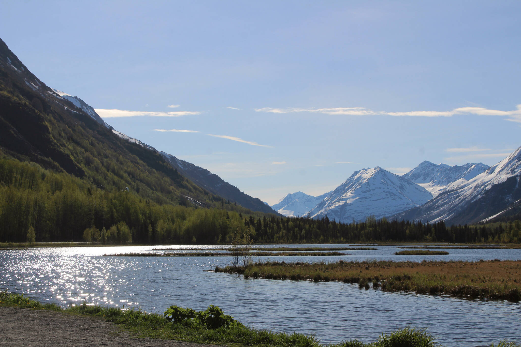 The sun shines over Tern Lake on Sunday, May 22, 2022 near Cooper Landing, Alaska. (Ashlyn O'Hara/Peninsula Clarion)