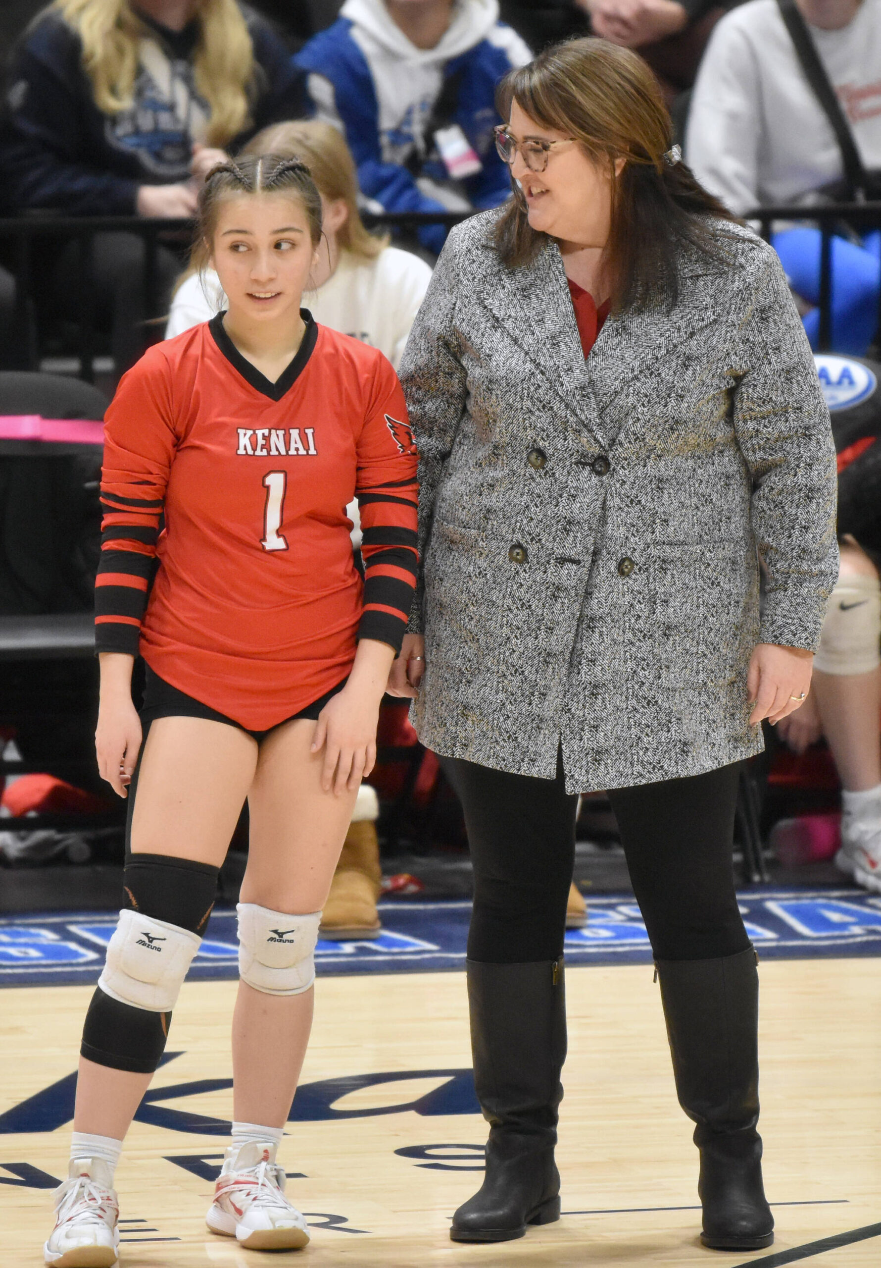 Kenai Central libero Jaycie Castillo talks with head coach Tracie Beck before a set at the Class 3A state volleyball tournament Saturday, Nov. 11, 2023, at the Alaska Airlines Center in Anchorage, Alaska. (Photo by Jeff Helminiak/Peninsula Clarion)