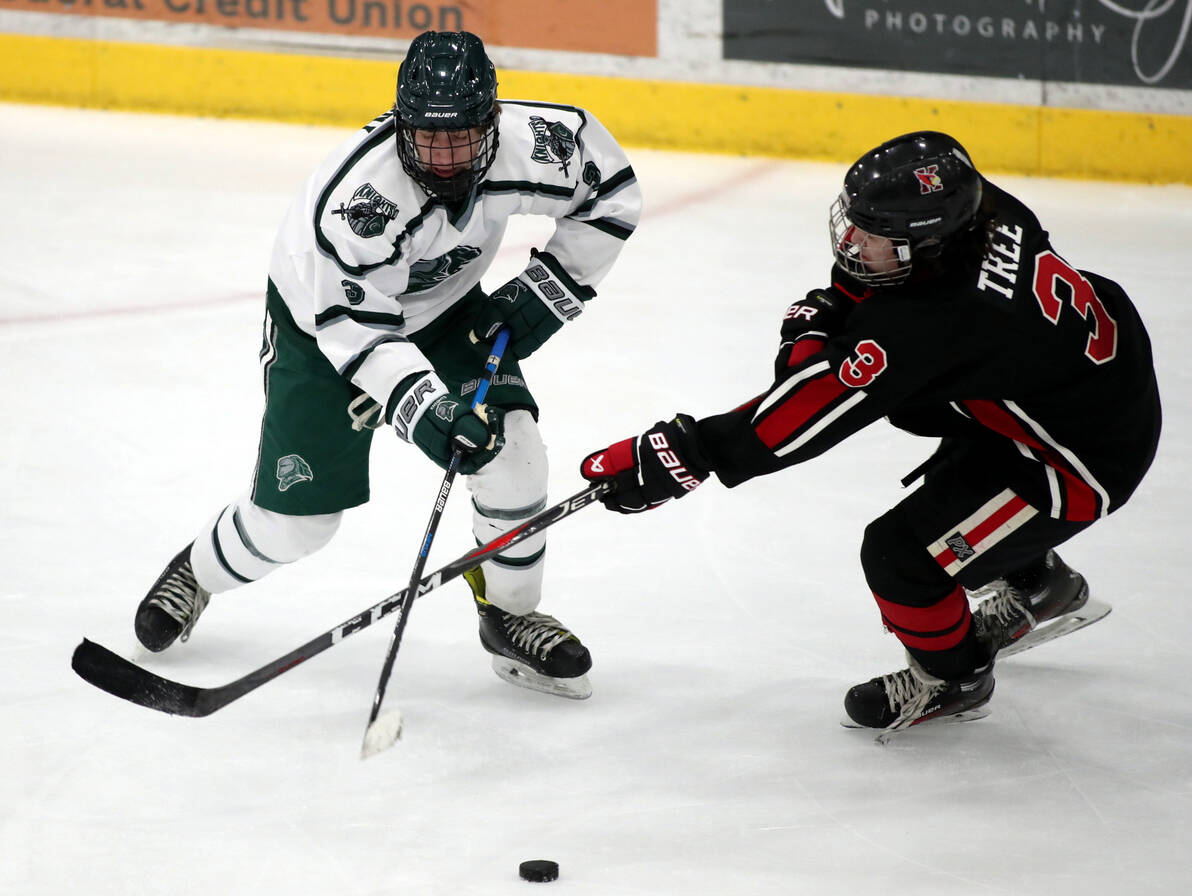 Kenais’ Ethan tree tries to poke the puck away from Colony’s Boston Weiland during a 6-6 tie Friday, Dec. 8, 2023, at the Menard Arena in Wasilla, Alaska. (Photo by Bruce Eggleston/matsusports.net)