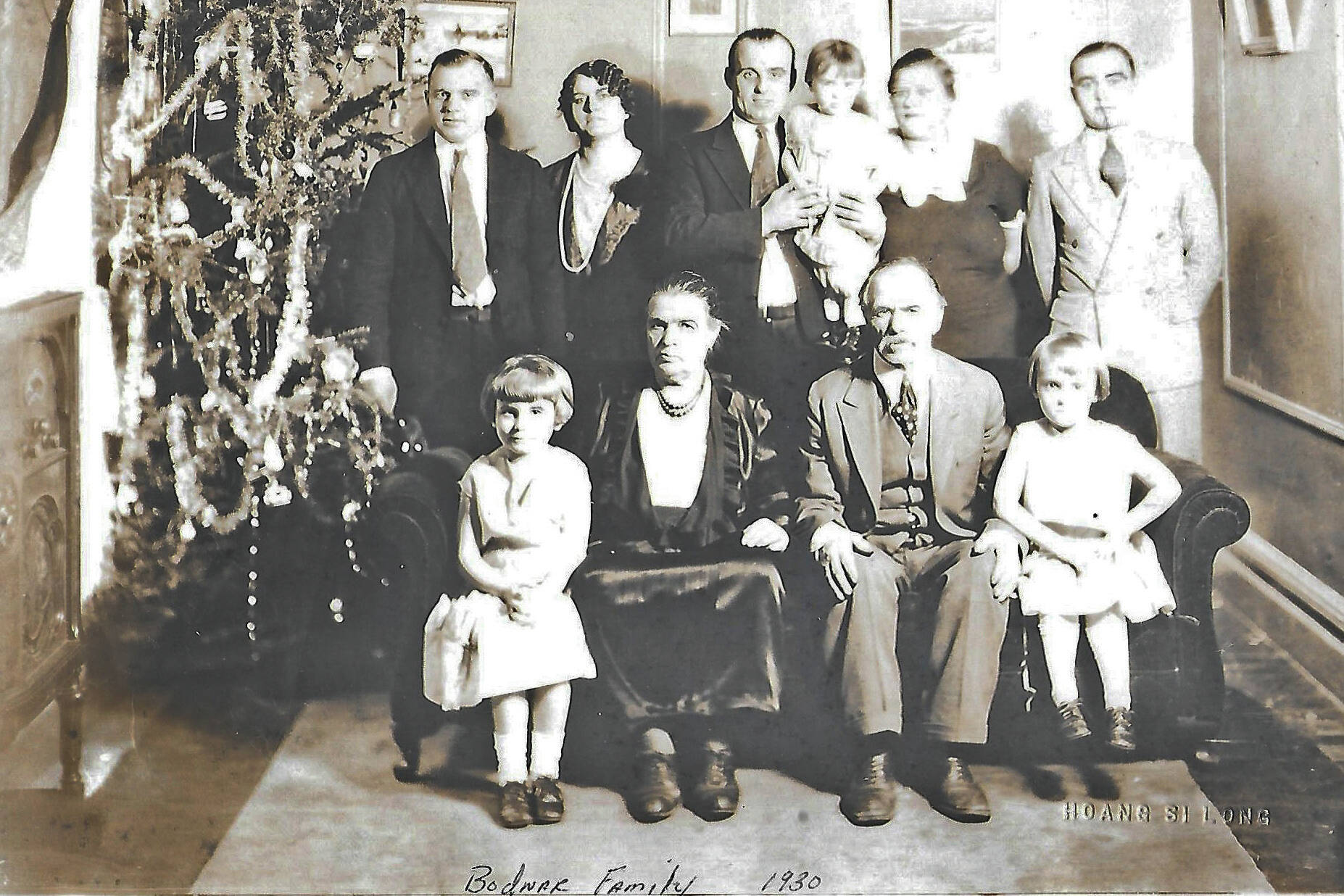 Peter and Pearl Bodnar (front, center) pose for a 1930 Christmas portrait with much of their family, probably in Manitoba, Canada. Pictured are: (back row, L-R) Alex, sister Anna (Bodnar) Bandura, brother Michael holding daughter Pearl next to his wife Jessie, and Marcus. In the front row are: Michael’s eldest daughter Olga, parents Parascevies “Pearl” and Peter Bodnar, and Michael’s middle daughter Marion. (Photo courtesy of the Bodnar Family Collection)