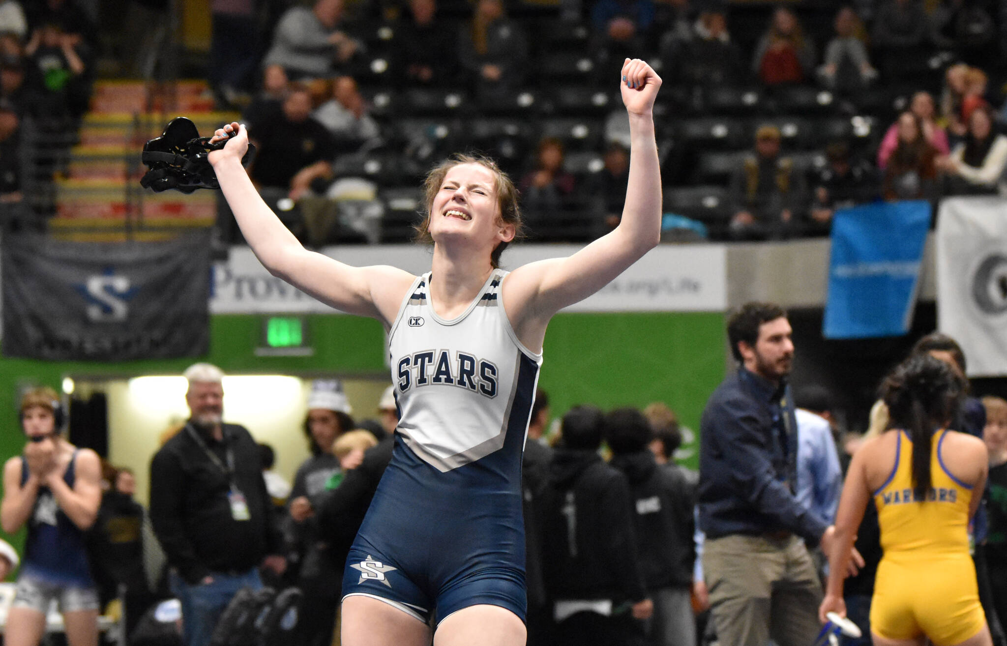 Soldotna’s Kaytlin McAnelly celebrates winning the girls title at 132 pounds Saturday, Dec. 16, 2023, at the state wrestling tournament at the Alaska Airlines Center in Anchorage, Alaska. (Photo by Jeff Helminiak/Peninsula Clarion)