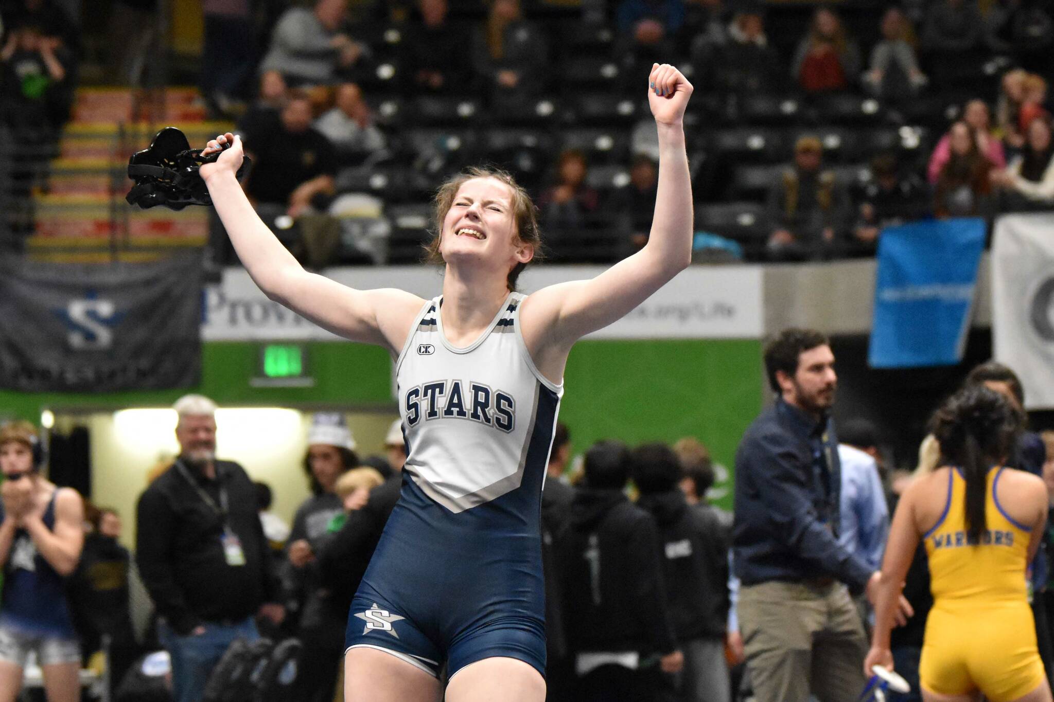 Soldotna's Kaytlin McAnelly celebrates winning the girls title at 132 pounds Saturday, Dec. 16, 2023, at the state wrestling tournament at the Alaska Airlines Center in Anchorage, Alaska. (Photo by Jeff Helminiak/Peninsula Clarion)