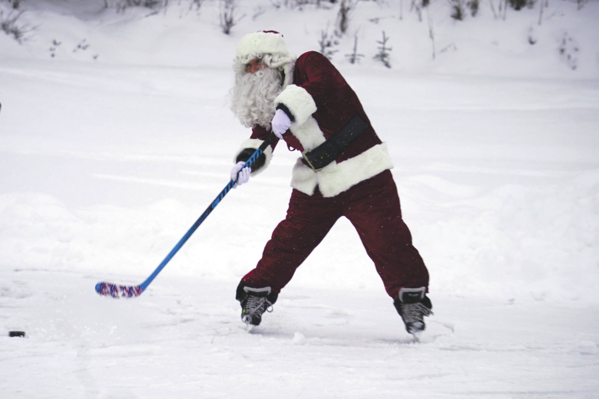 Jake Dye/Peninsula Clarion
Santa Claus joins children for some hockey action during A Day with the Clauses festivities at Daubenspeck Park in Kenai on Monday.