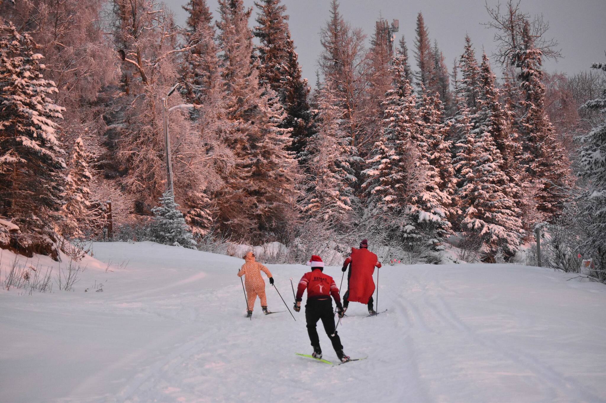 Skiers pursue stations at the Candy Cane Scramble on Friday, Dec. 15, 2023, at Tsalteshi Trails just outside of Soldotna, Alaska. (Photo by Jeff Helminiak/Peninsula Clarion)