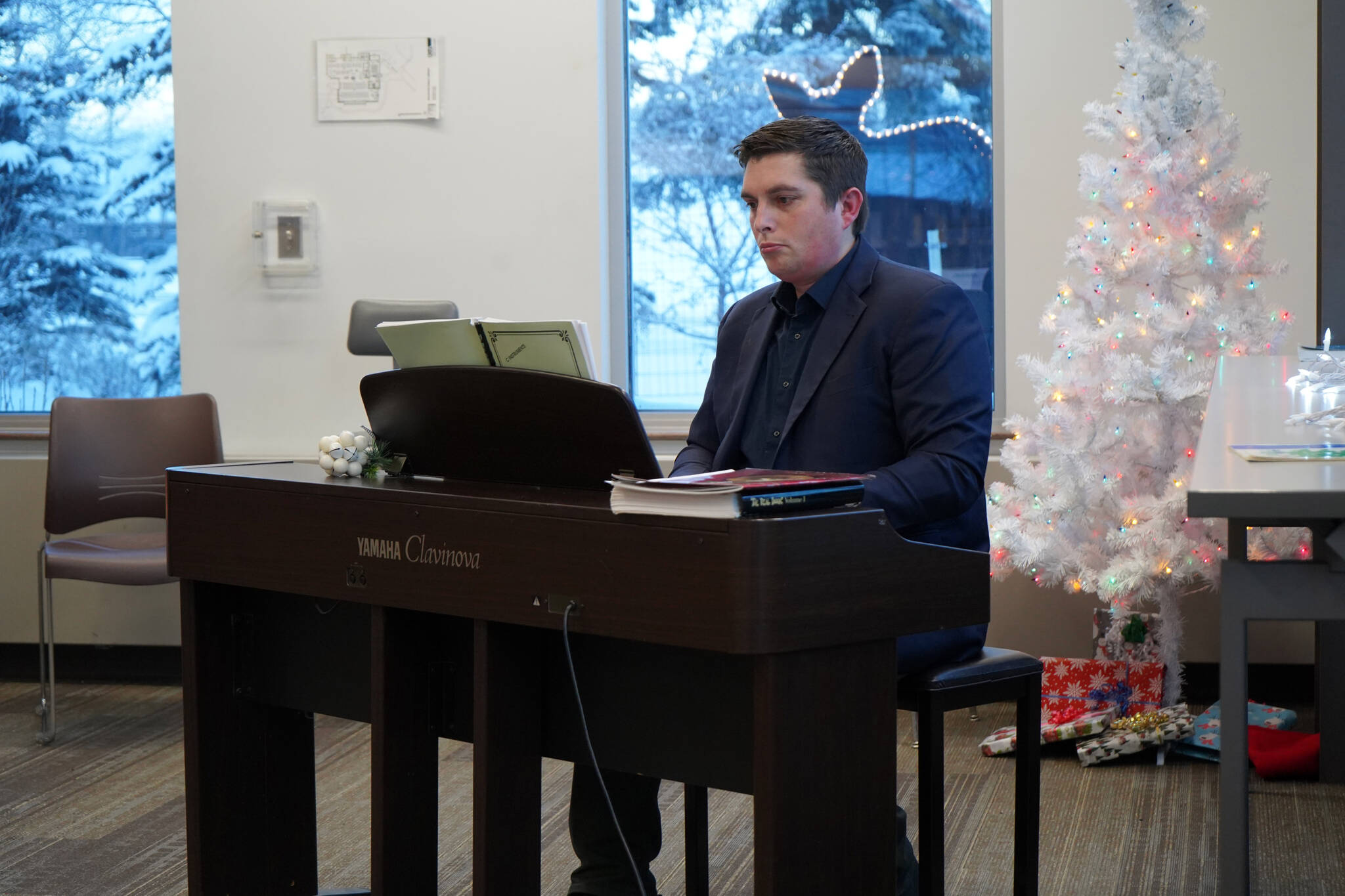 Justin Ruffridge performs during Music by the Fire at the Soldotna Public Library in Soldotna, Alaska, on Thursday, Dec. 21, 2023. (Jake Dye/Peninsula Clarion)