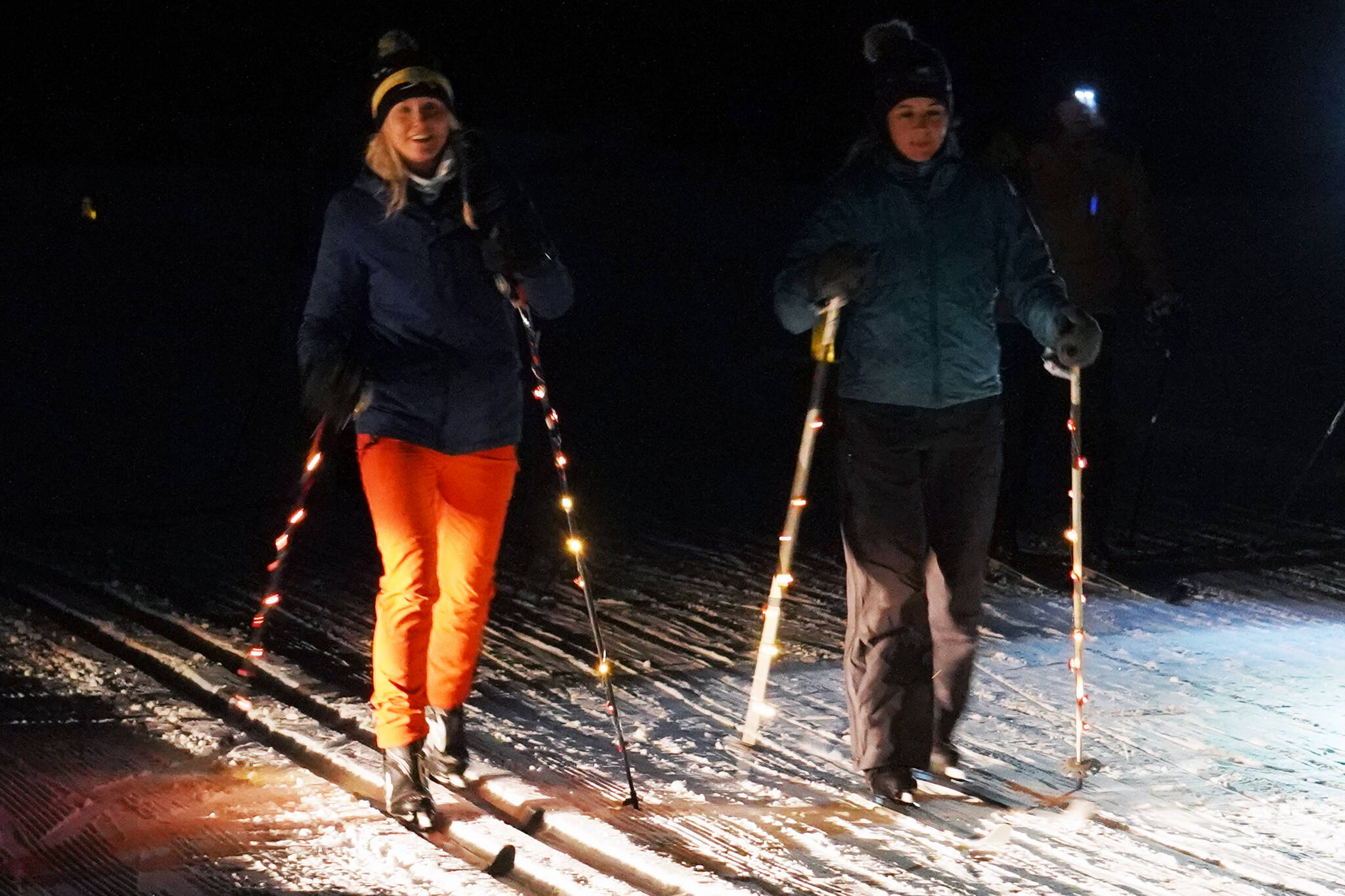 Skiers participate in the Third Annual StarLight StarBright winter solstice skiing fundraiser at the Kenai Golf Course in Kenai, Alaska, on Thursday, Dec. 21, 2023. (Jake Dye/Peninsula Clarion)