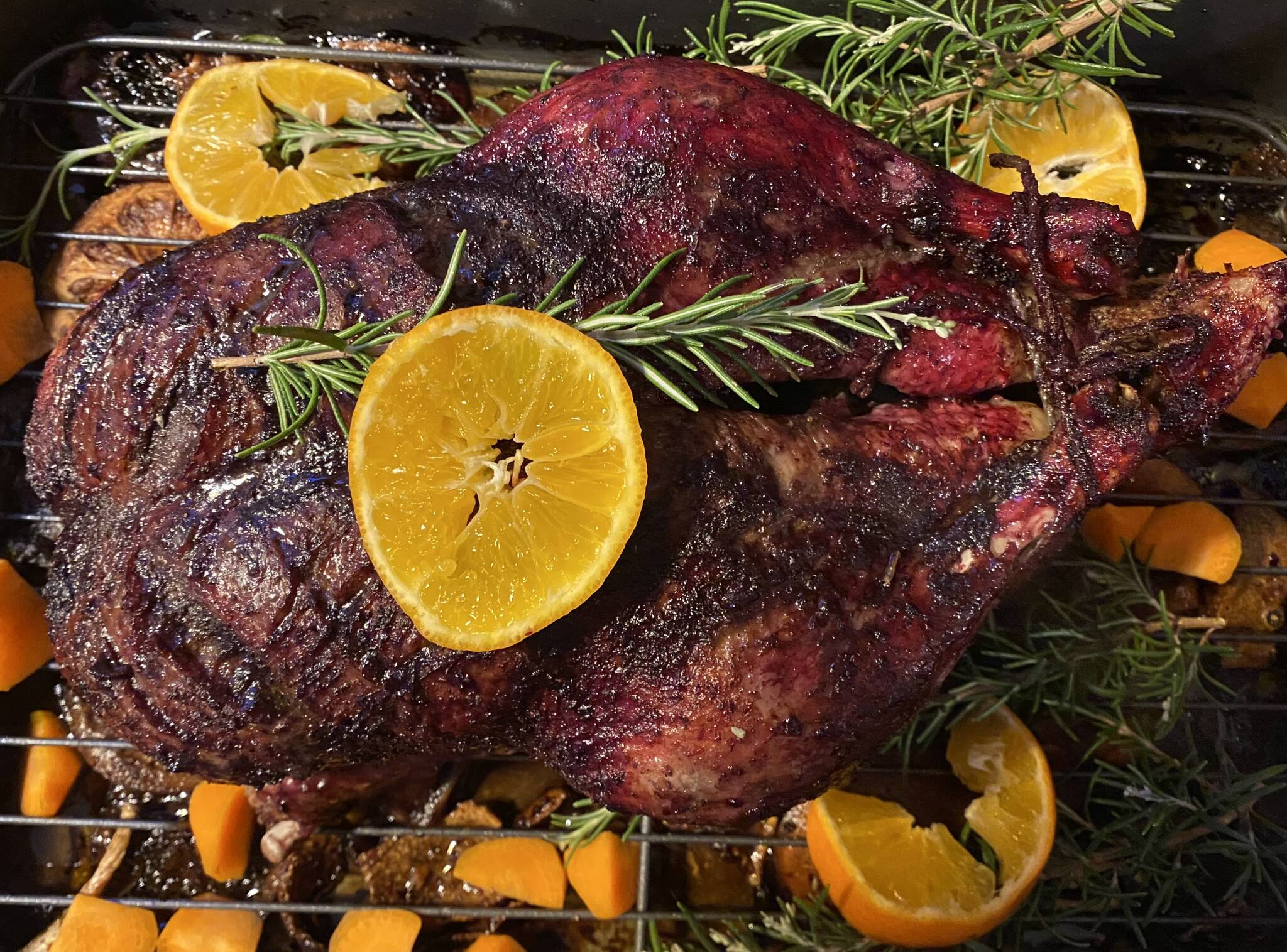 Roasted duck is served with rosemary and oranges. (Photo by Tressa Dale/Peninsula Clarion)