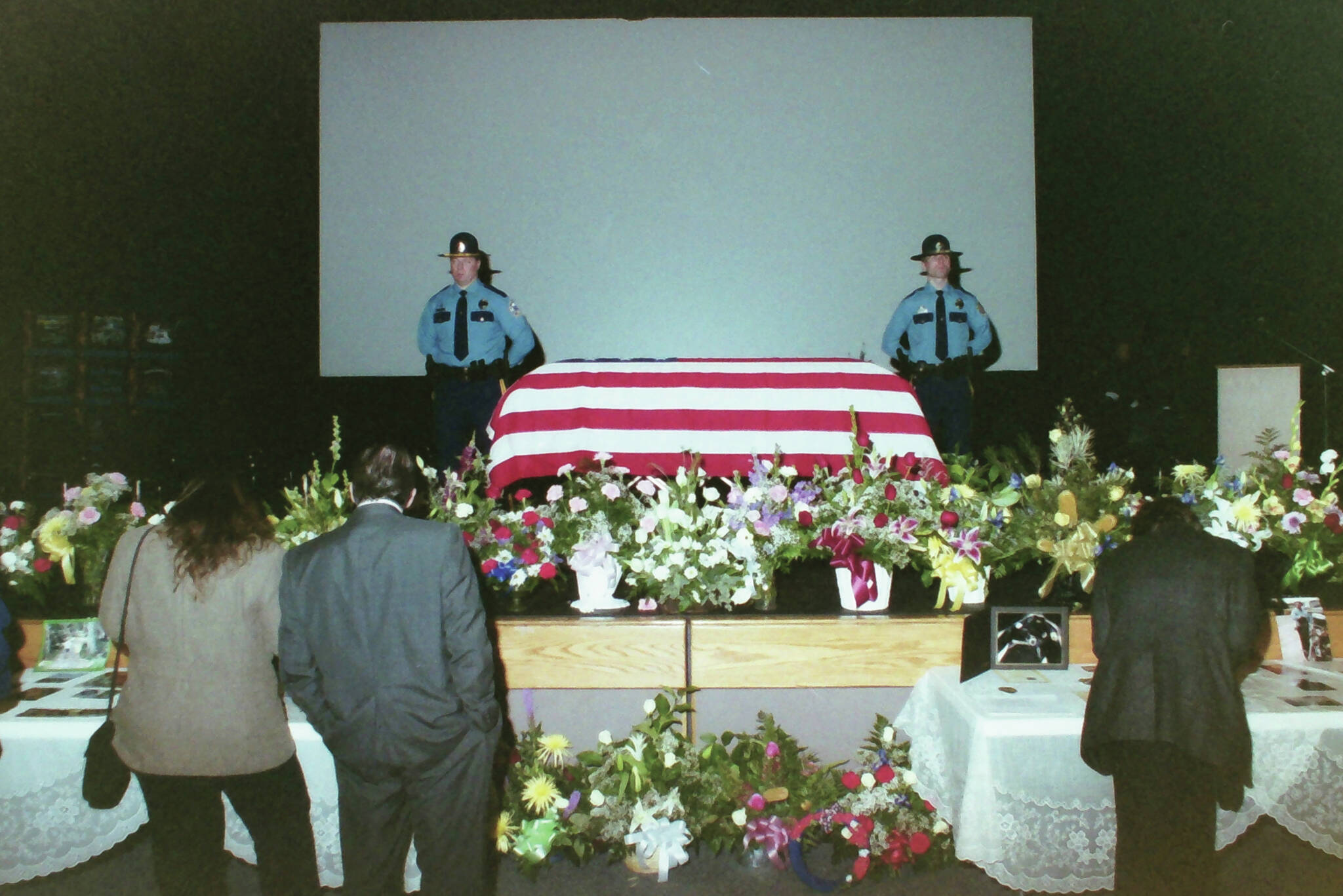 Alaska State Troopers flank the casket of Kenai Police Officer John Watson during a memorial service on Wednesday, Dec. 31, 2003 in Kenai, Alaska. (Joseph Robertia/Peninsula Clarion)