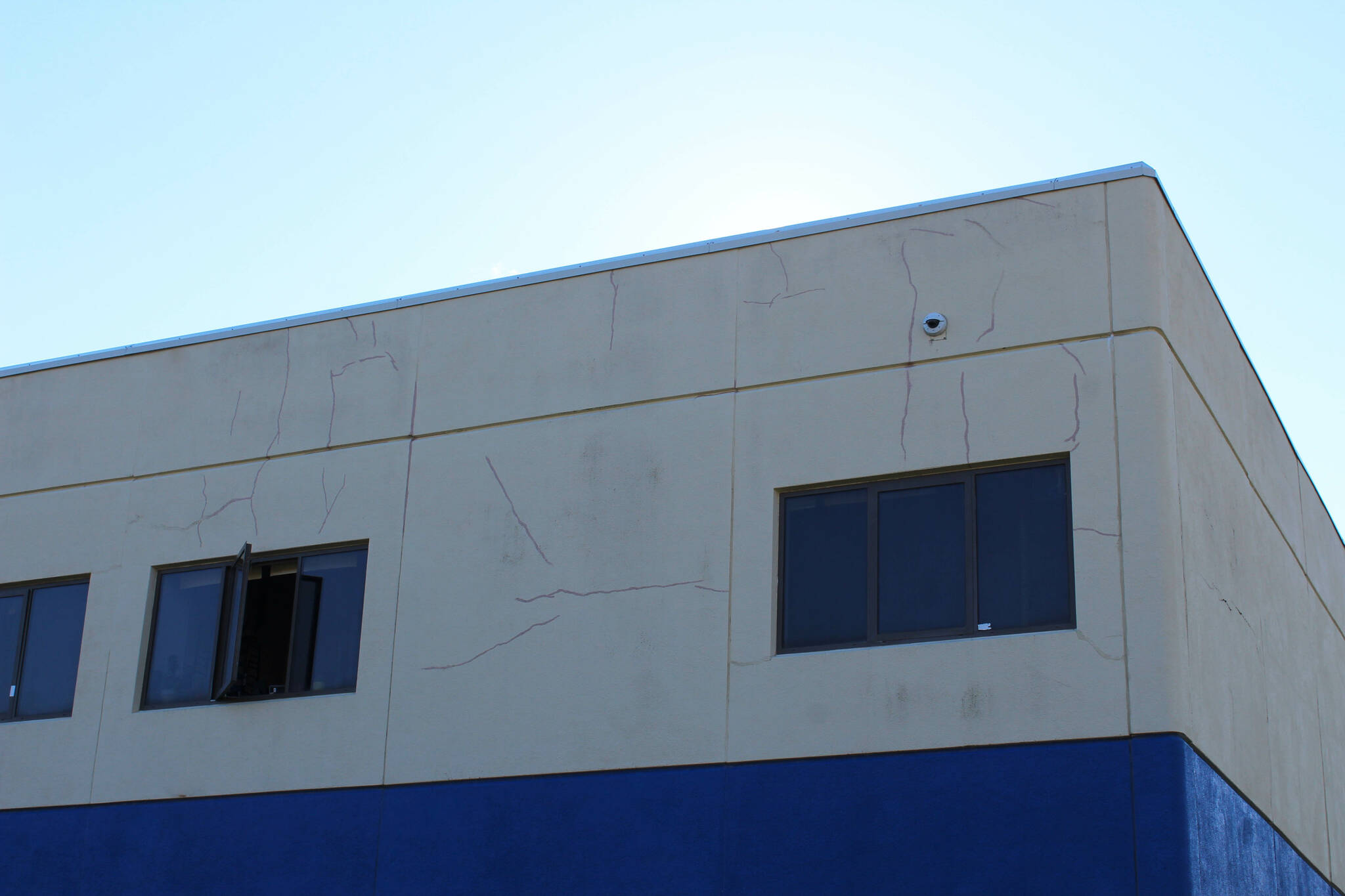 Cracks split the siding outside of Soldotna High School on Tuesday, Sept. 27, 2022, in Soldotna, Alaska. The siding is one of several projects in a bond package Kenai Peninsula voters will consider during the Oct. 4 municipal election next month. (Ashlyn O’Hara/Peninsula Clarion)