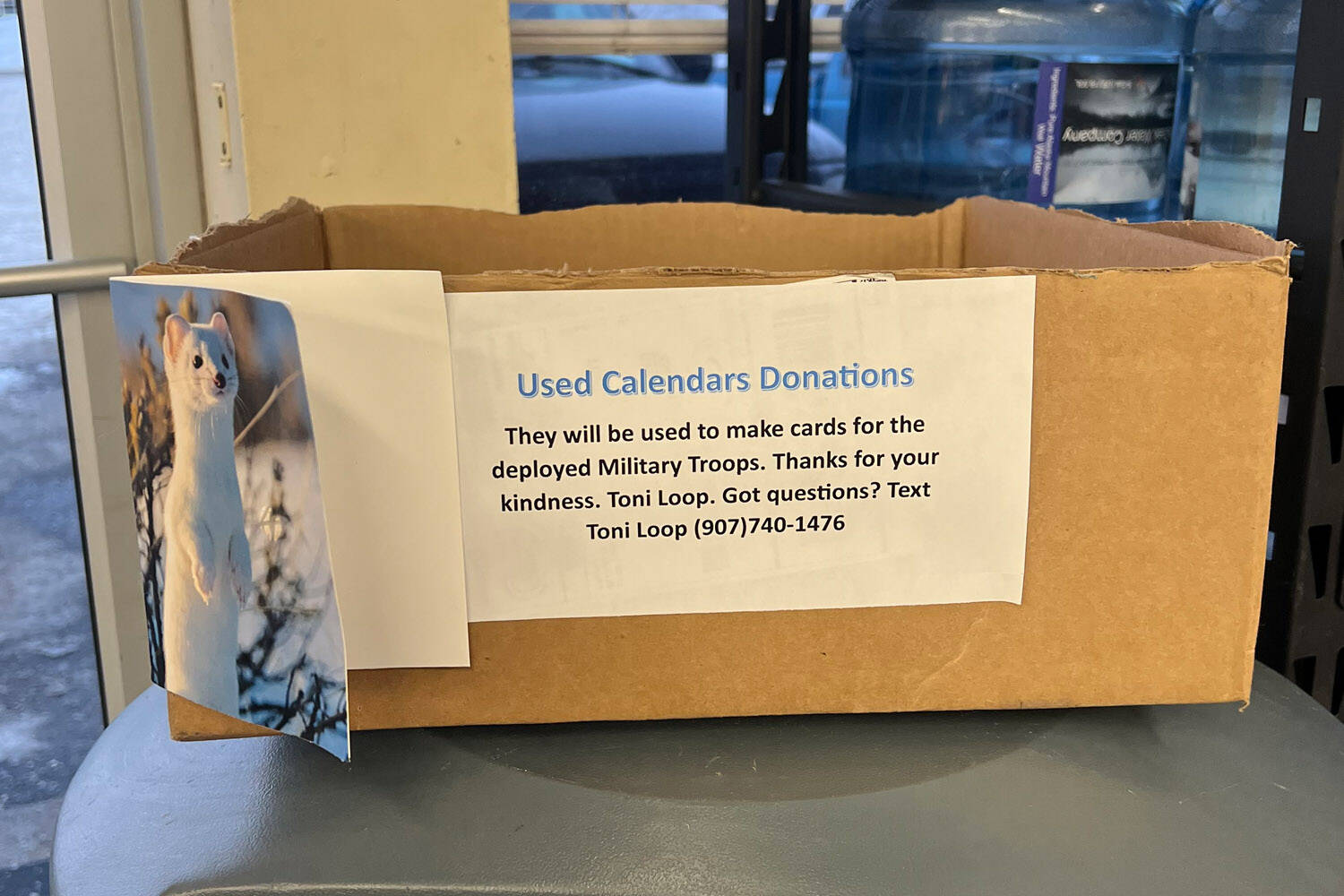 A donation box for used calendars is displayed at M&M Market in Nikiski, Alaska, on Wednesday, Jan. 3, 2024. (Photo courtesy Toni Loop)