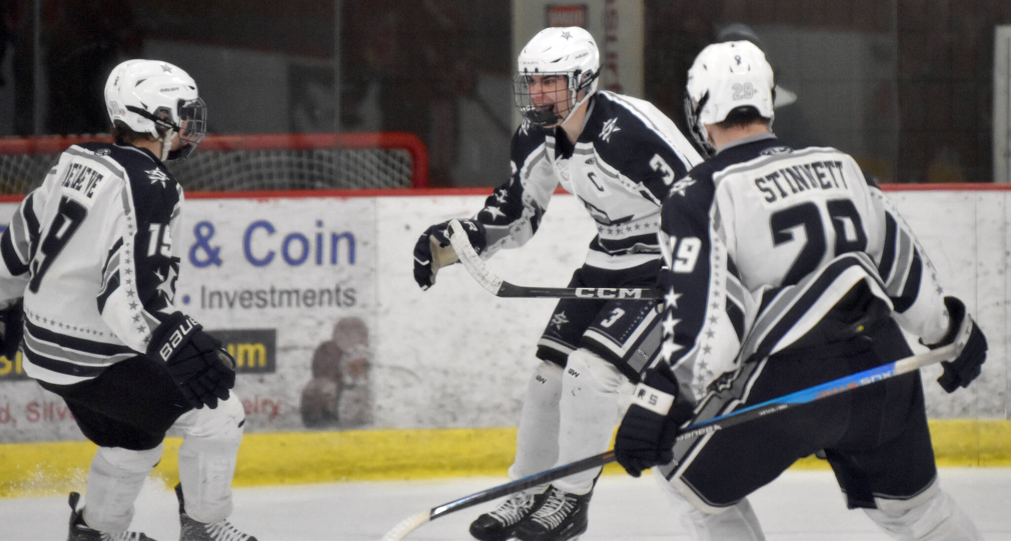 Soldotna’s Andrew Arthur celebrates his goal against Kenai Central with teammates Marshall Deraeve and Aiden Stinnett on Friday, Jan. 5, 2024, at the Soldotna Regional Sports Complex in Soldotna, Alaska. (Photo by Jeff Helminiak/Peninsula Clarion)