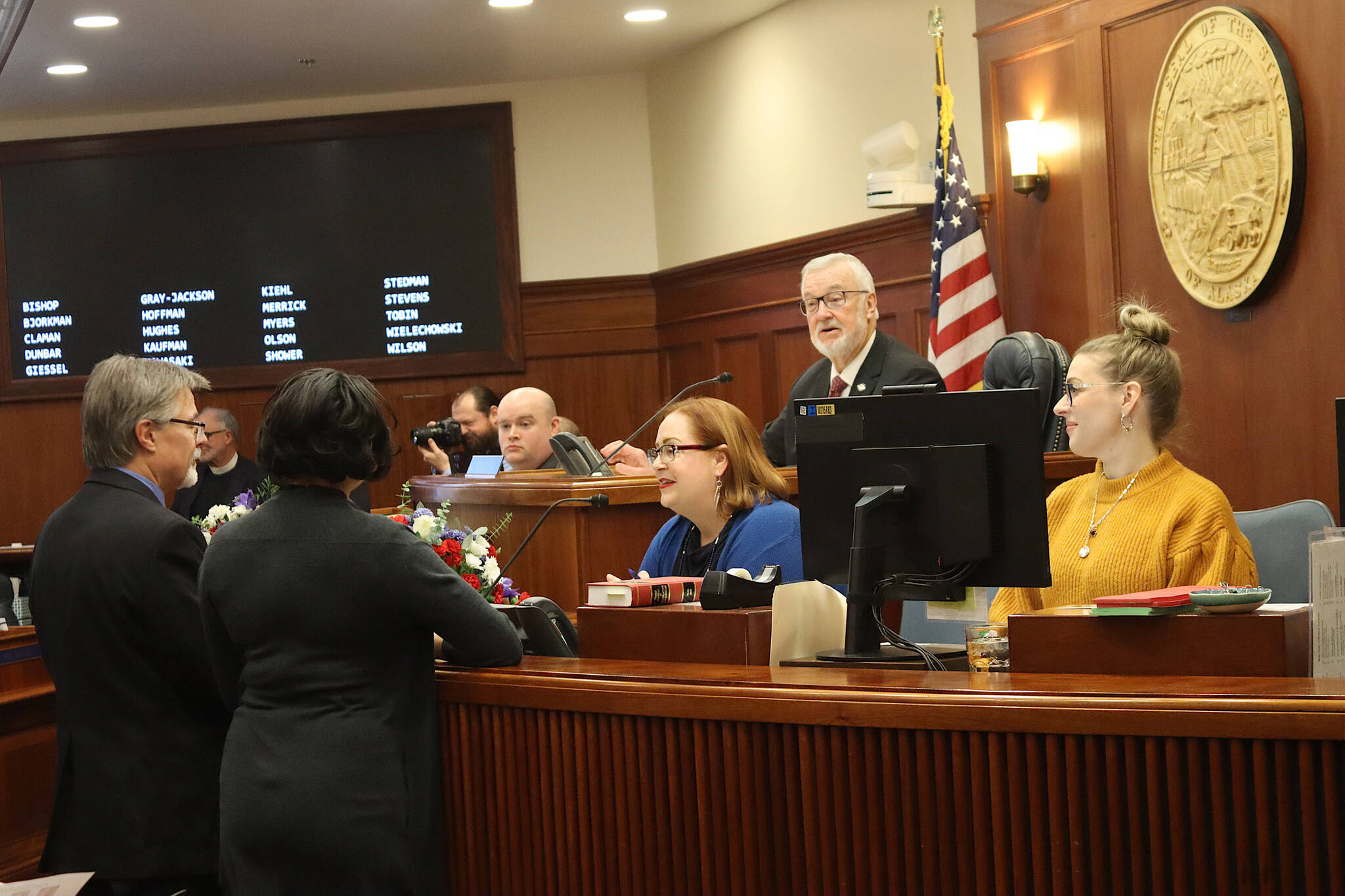 Senate President Gary Stevens, a Kodiak Republican, confers with other senators and legislative staff moments before gavelling in the start of this year’s legislative session at the Alaska State Capitol. (Mark Sabbatini / Juneau Empire)